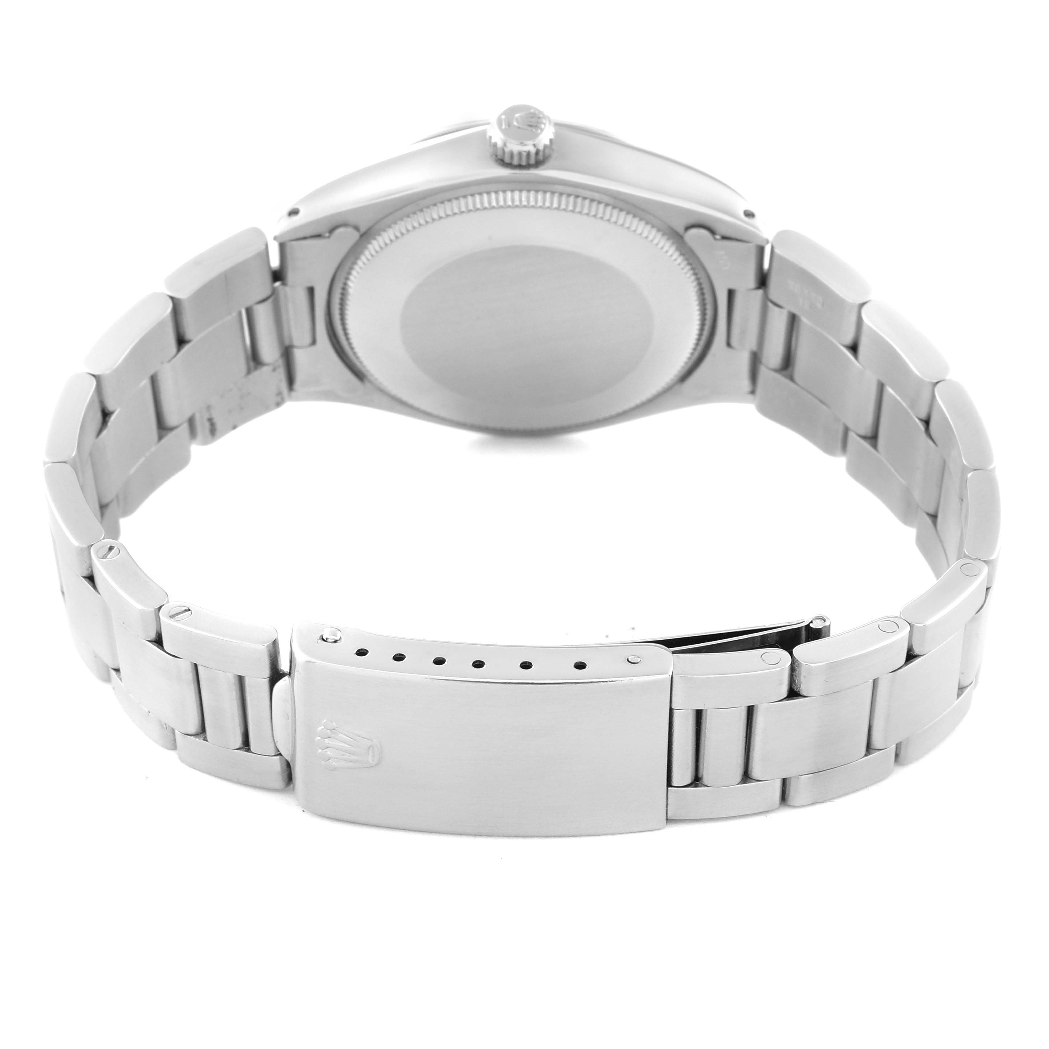 This image shows the back case and bracelet of a Vintage Collection Rolex watch, with a closed clasp.