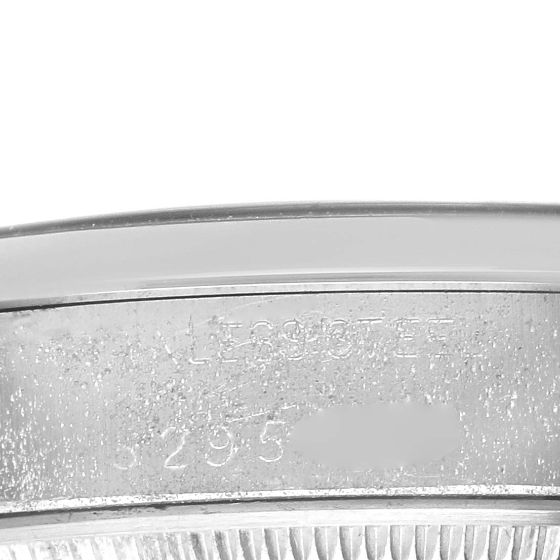 The image shows a close-up angle of the case side of the Rolex Vintage Collection 5500 Men's Stainless Steel Silver Dial 5500 Men's Stainless Steel Silver Dial model, focusing on the engraved serial number.