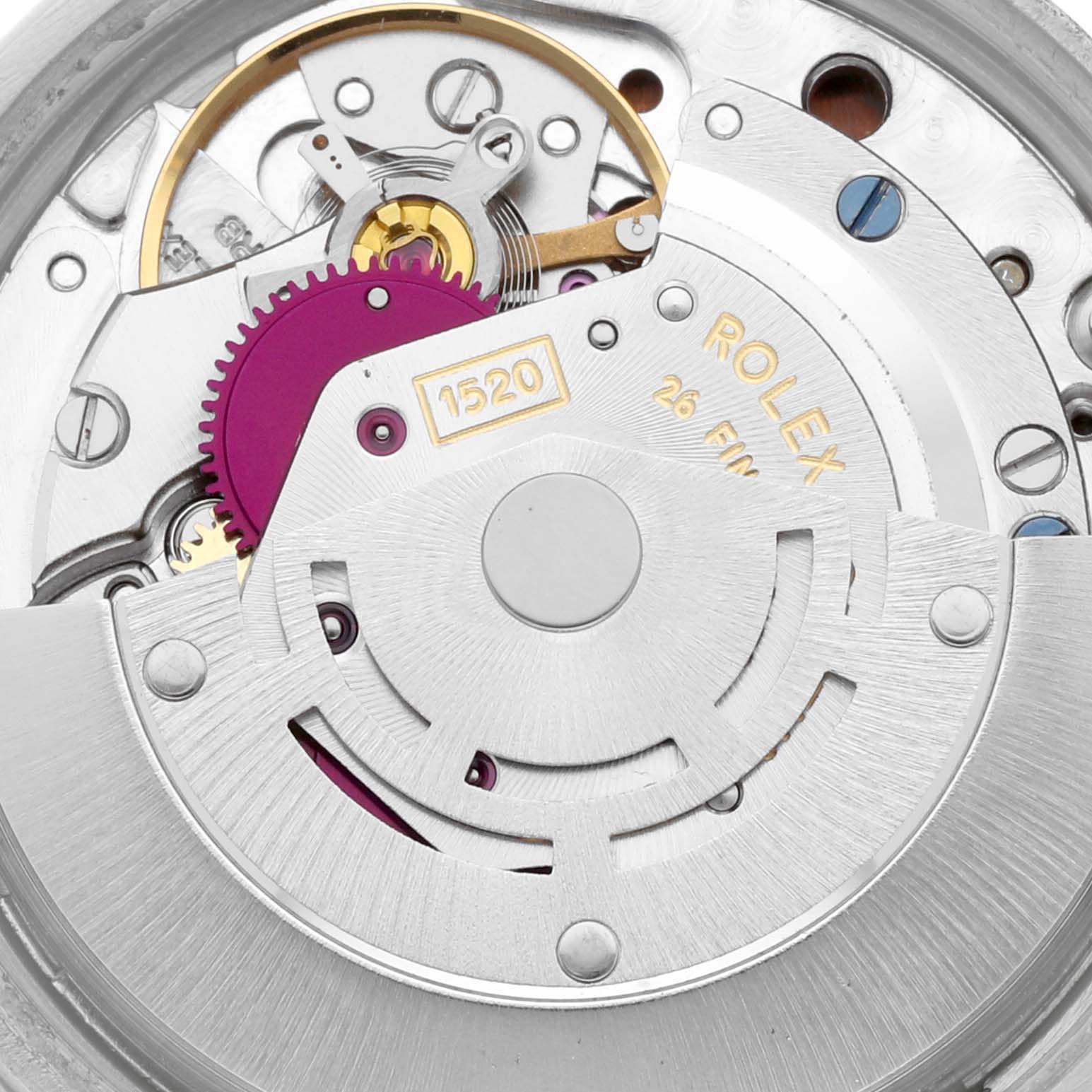 The image shows a close-up view of the mechanical movement of a Vintage Collection model by Rolex, highlighting gears and components.