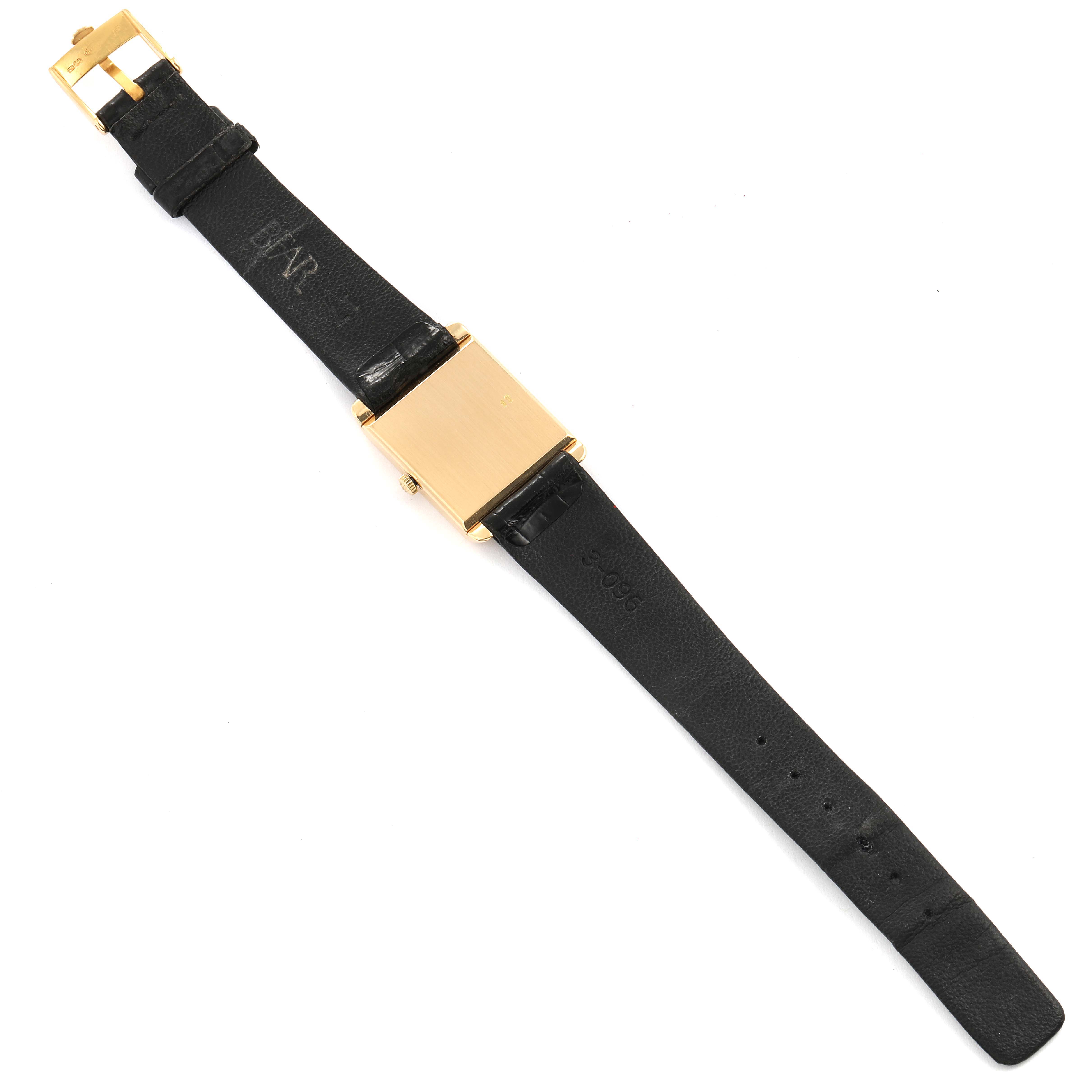 This image shows a Rolex Cellini 4103 Women's Yellow Gold Champagne Dial 4103 Women's Yellow Gold Champagne Dial watch laid flat, displaying its black leather strap, gold buckle, and square gold case.