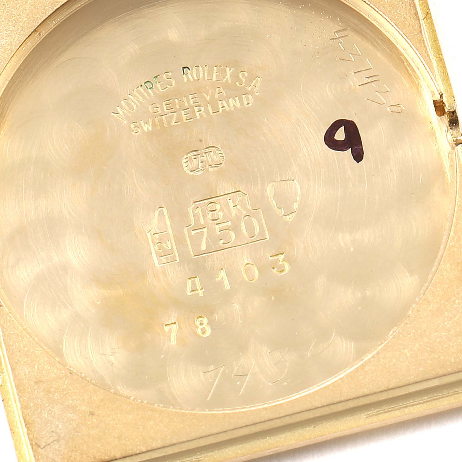 This is the inner case back of a Rolex Cellini 4103 Women's Yellow Gold Champagne Dial 4103 Women's Yellow Gold Champagne Dial watch, showing the model number, material details, and hallmark stamps.