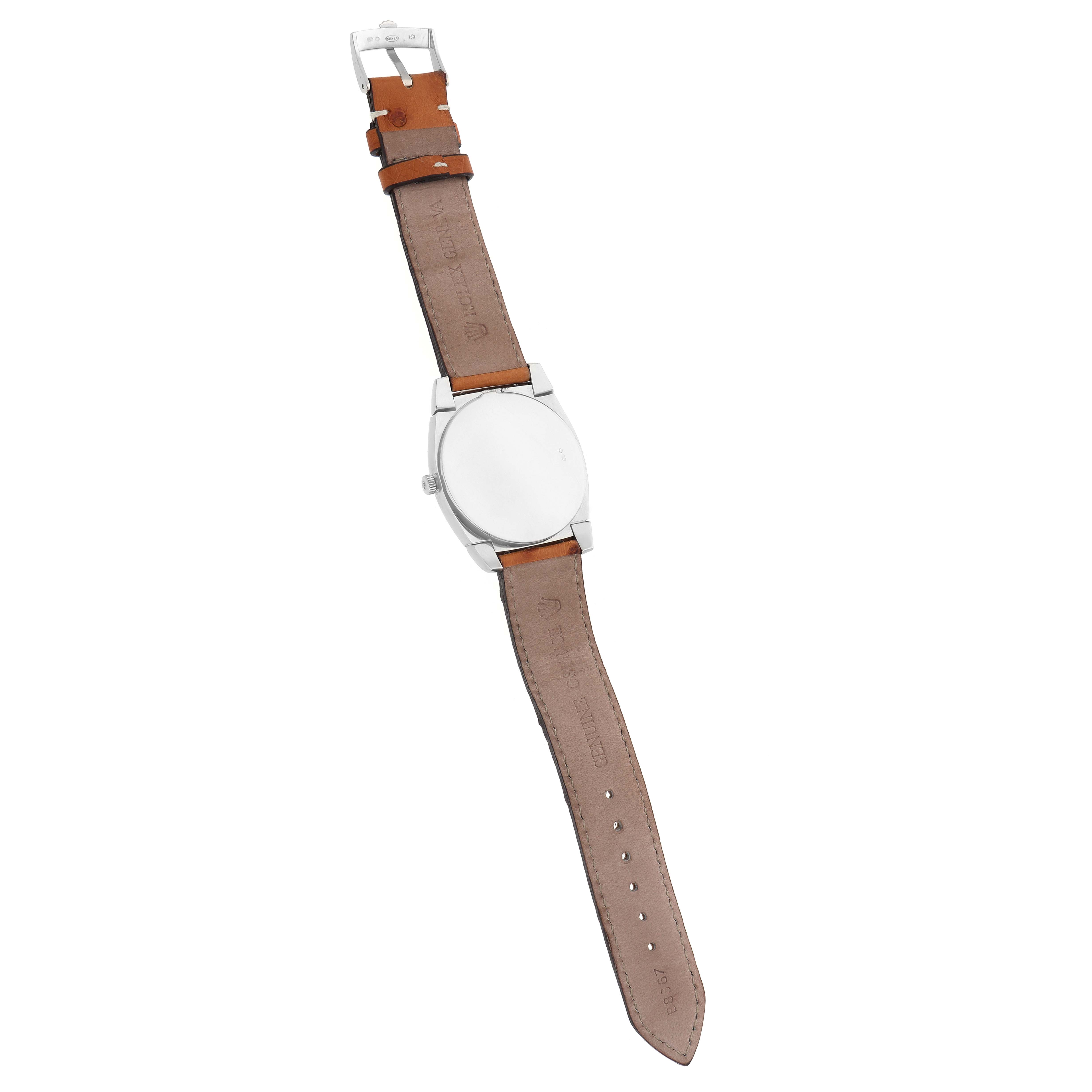 The Rolex Cellini 5330 Men
s White Gold White Dial model is shown from the back, highlighting the case back and leather strap.