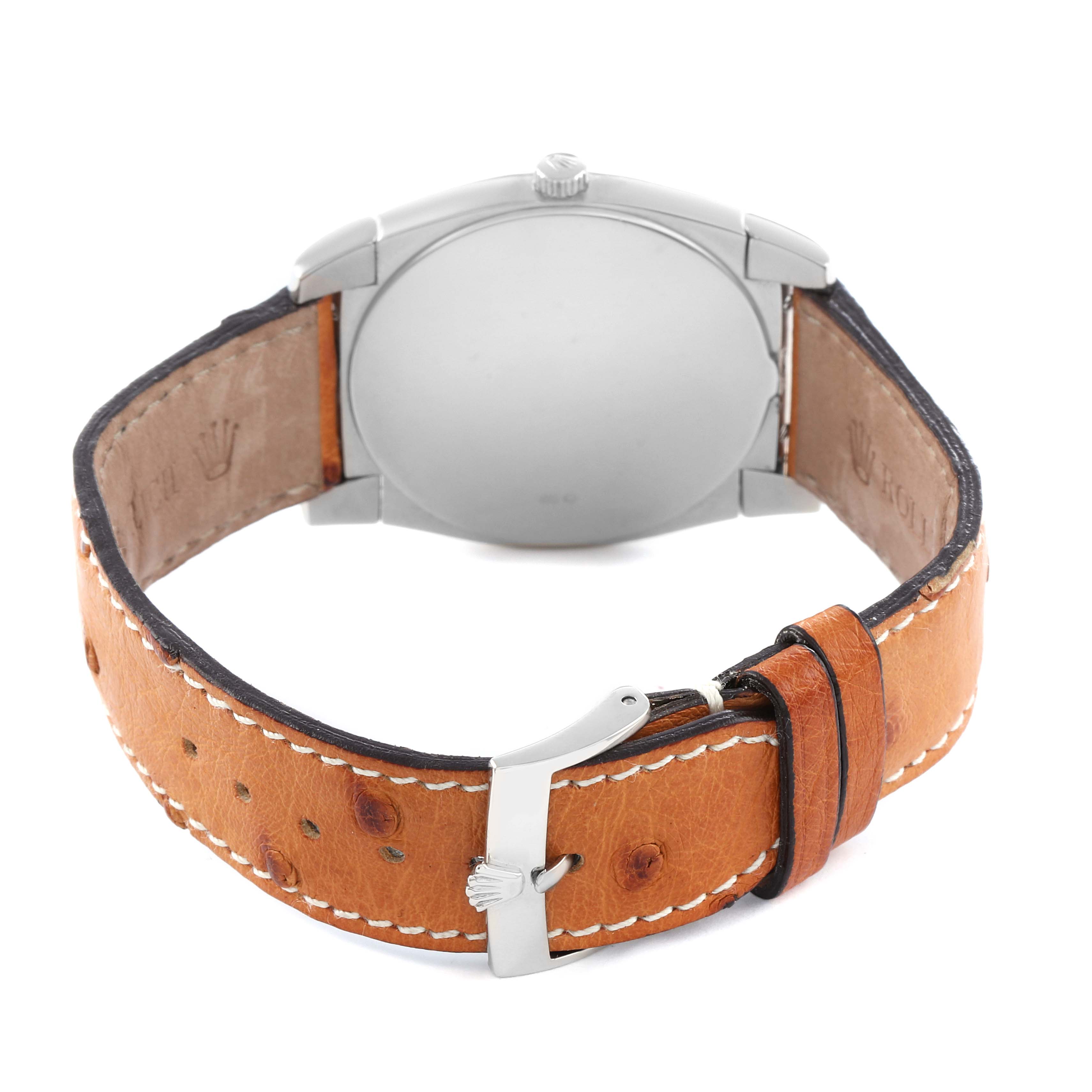 The image shows the back view of a Rolex Cellini 5330 Men
s White Gold White Dial watch, highlighting the leather strap and closed buckle.