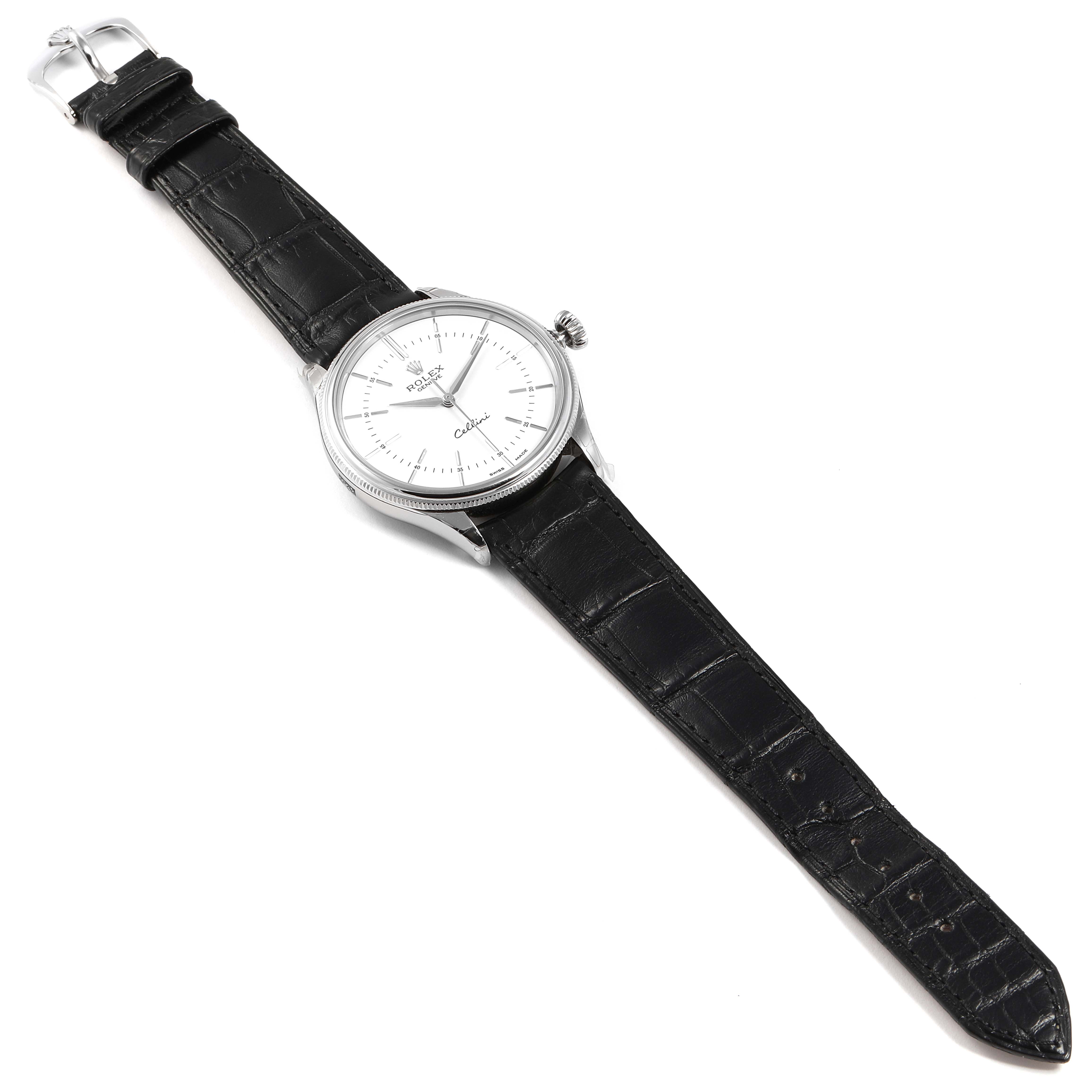 This Rolex Cellini 50509 Men
s White Gold White Dial 50509 Men
s White Gold White Dial watch is shown from an overhead angle, displaying its black leather strap, dial, crown, and buckle.
