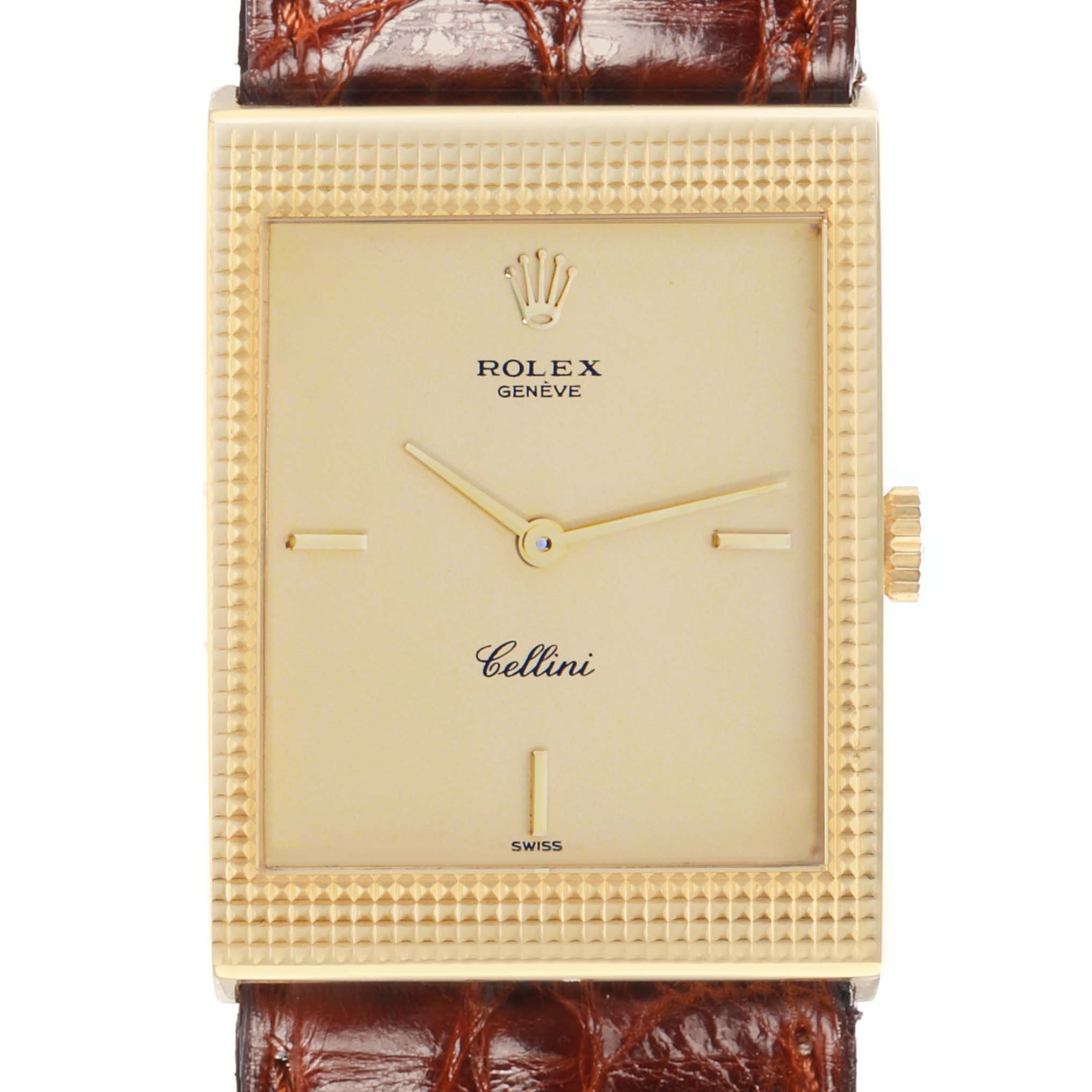 The Rolex Cellini 4127 Men
s Yellow Gold Champagne Dial watch is shown from the front, highlighting the rectangular dial, crown, and part of the leather strap.