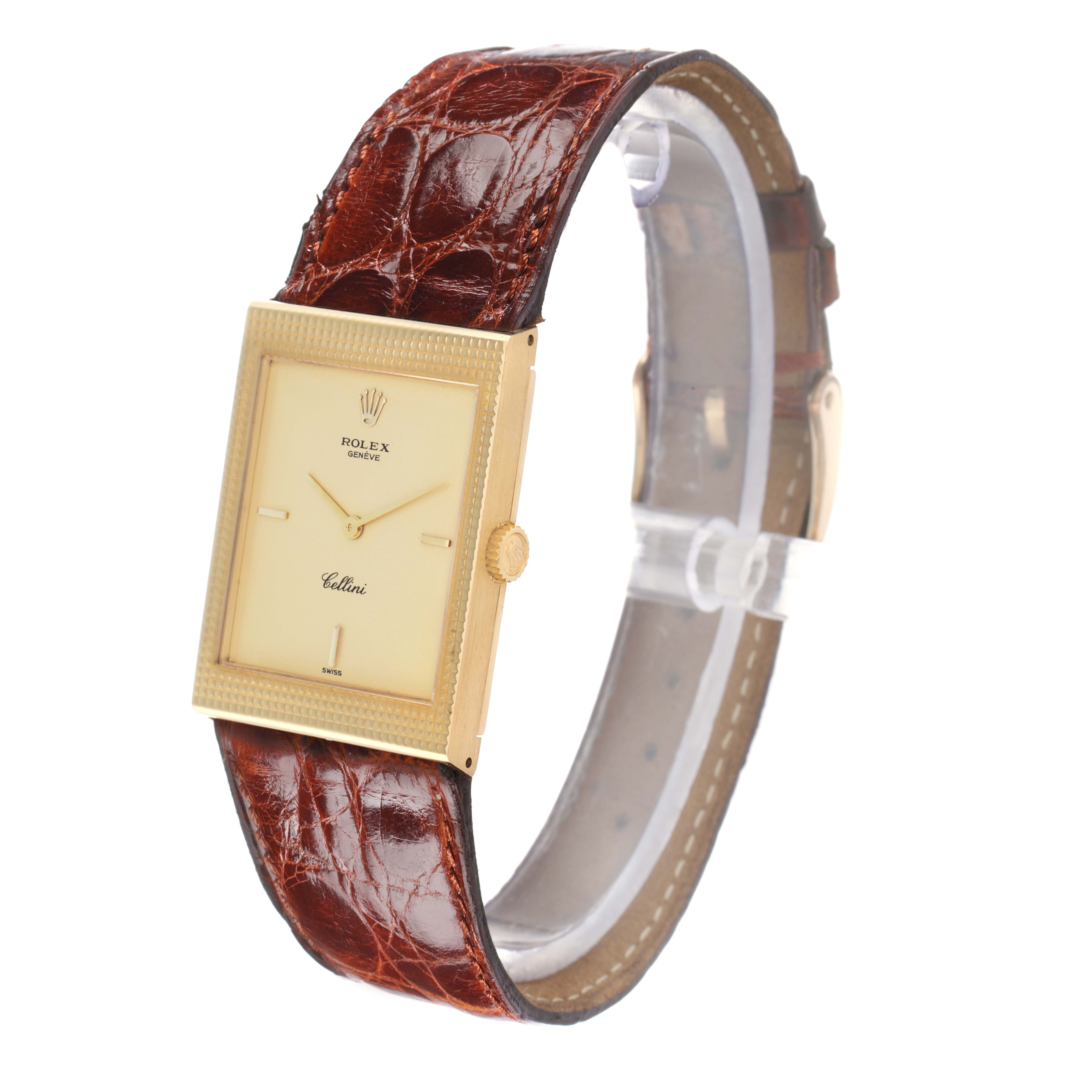 The Rolex Cellini 4127 Men
s Yellow Gold Champagne Dial watch is shown at a three-quarter angle, displaying the face, bezel, crown, and leather strap.