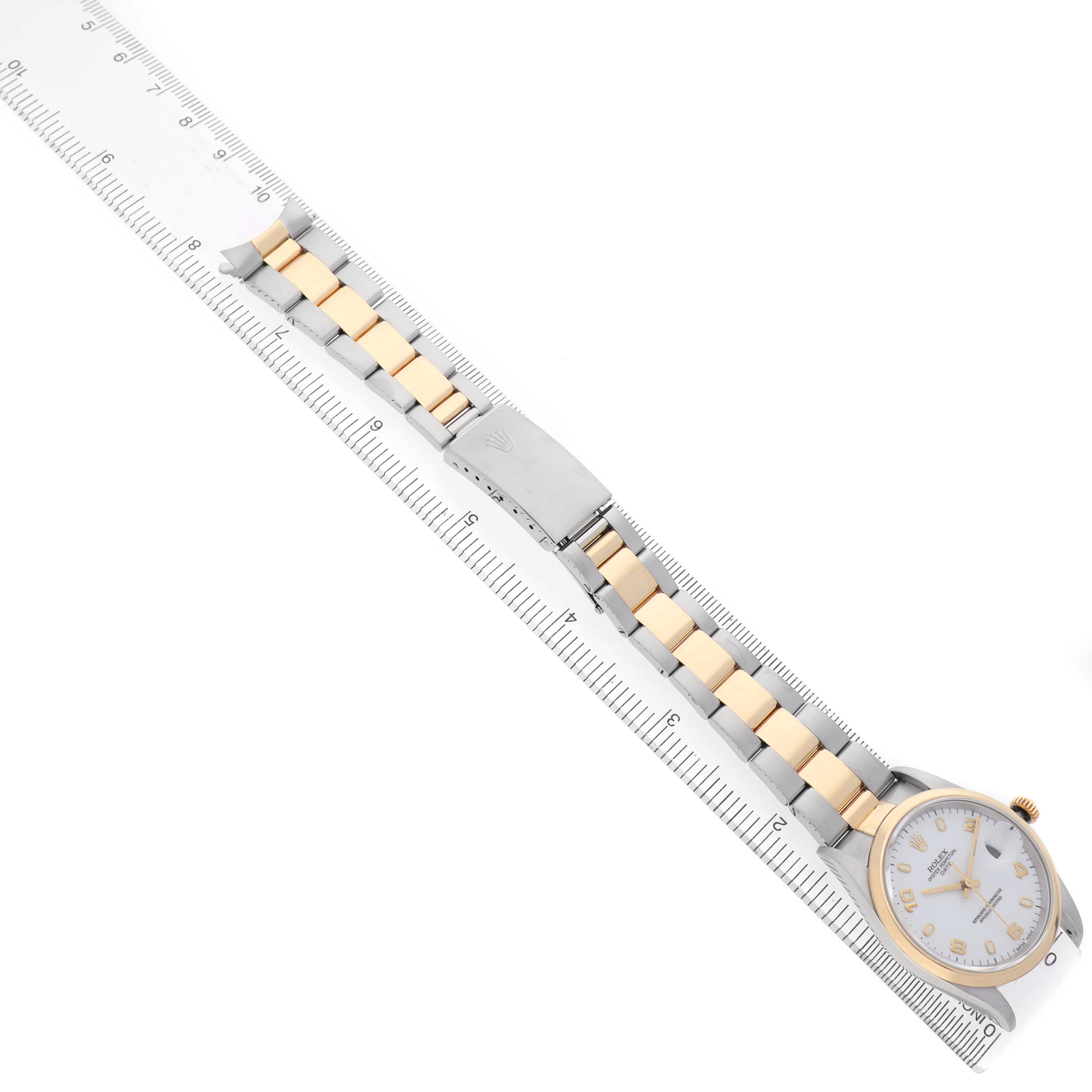 The Rolex Date 15203 Men's Steel and Gold (two tone) White Dial watch is shown from a top-down angle, highlighting the bracelet, clasp, and face.