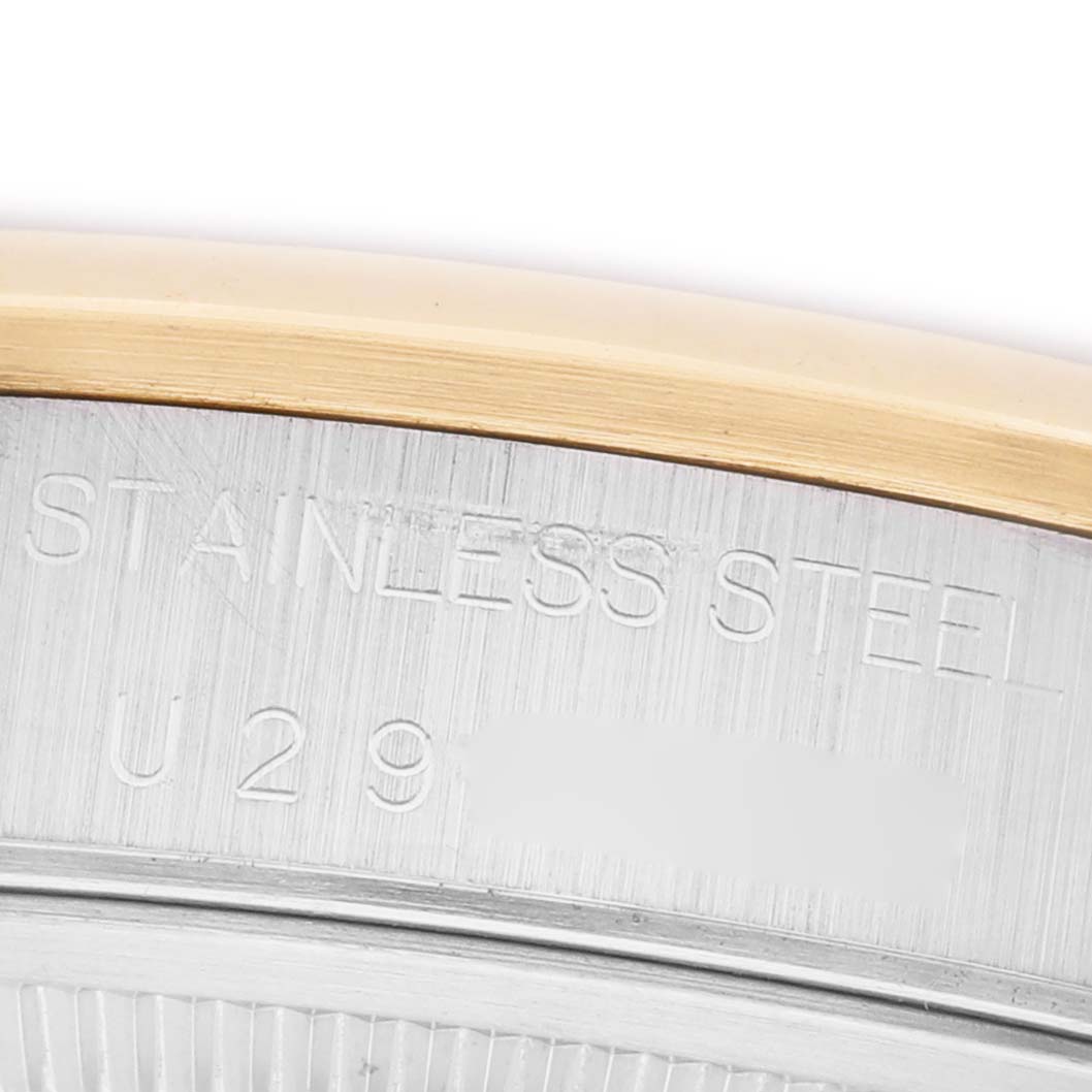 The image shows a close-up angle of the casing for the Rolex Date 15203 Men's Steel and Gold (two tone) White Dial model, highlighting the stainless steel and gold accents.
