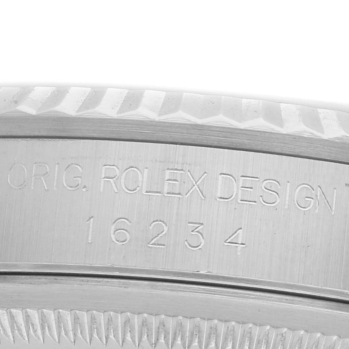The image shows a close-up of the Rolex Datejust 16234 Men
s Stainless Steel Silver Dial
s case edge, highlighting the model number "16234" with visible engraving details.