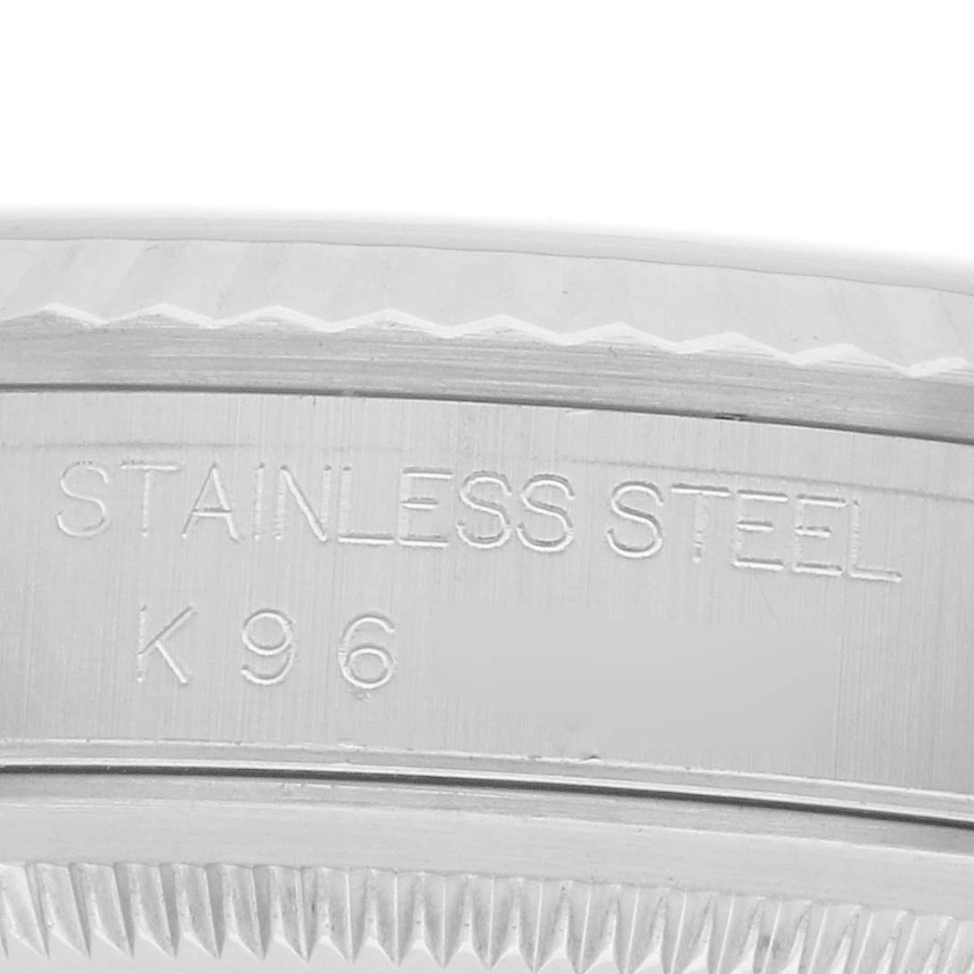 The image shows a close-up of the stainless steel case back engraving on a Rolex Datejust 16234 Men
s Stainless Steel Silver Dial watch.