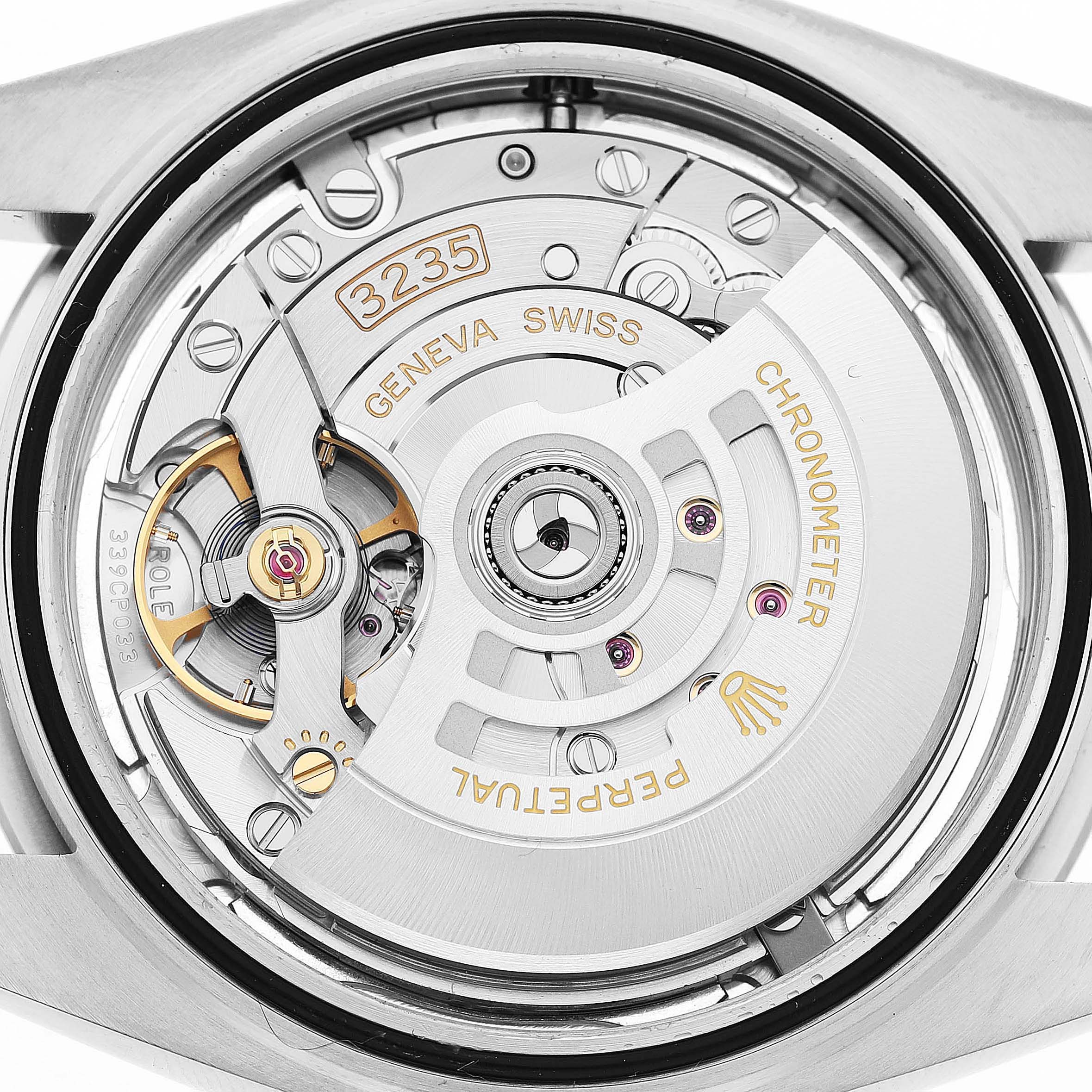 The image shows the case back, revealing the movement of the Rolex Datejust 41 126300 Men's Stainless Steel Blue Dial.