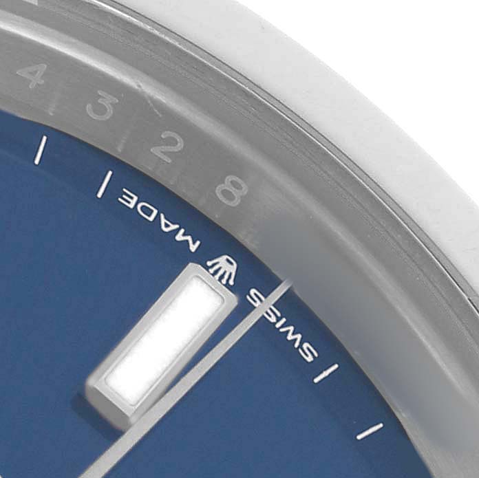 The image shows a close-up angle of the Rolex Datejust 41 126300 Men's Stainless Steel Blue Dial, highlighting the dial, with visible markers, text, and partial bezel.