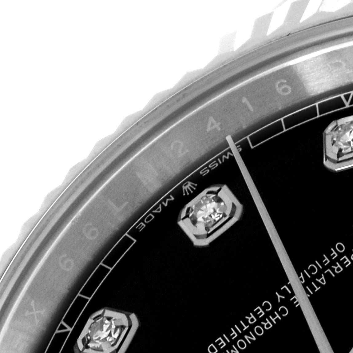 This close-up angle shows the top left portion of the dial and bezel of a Rolex Datejust 41 126334 Men's Stainless Steel Black Dial 126334 Men's Stainless Steel Black Dial, highlighting the "SWISS MADE" text and diamond hour markers.