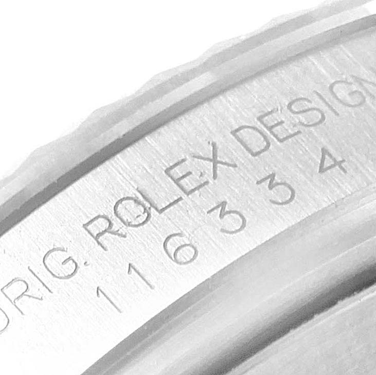 The image shows a close-up of the engraving on the case of a Rolex Datejust 41 116334 Men
s Stainless Steel Blue Dial 116334 Men
s Stainless Steel Blue Dial watch.
