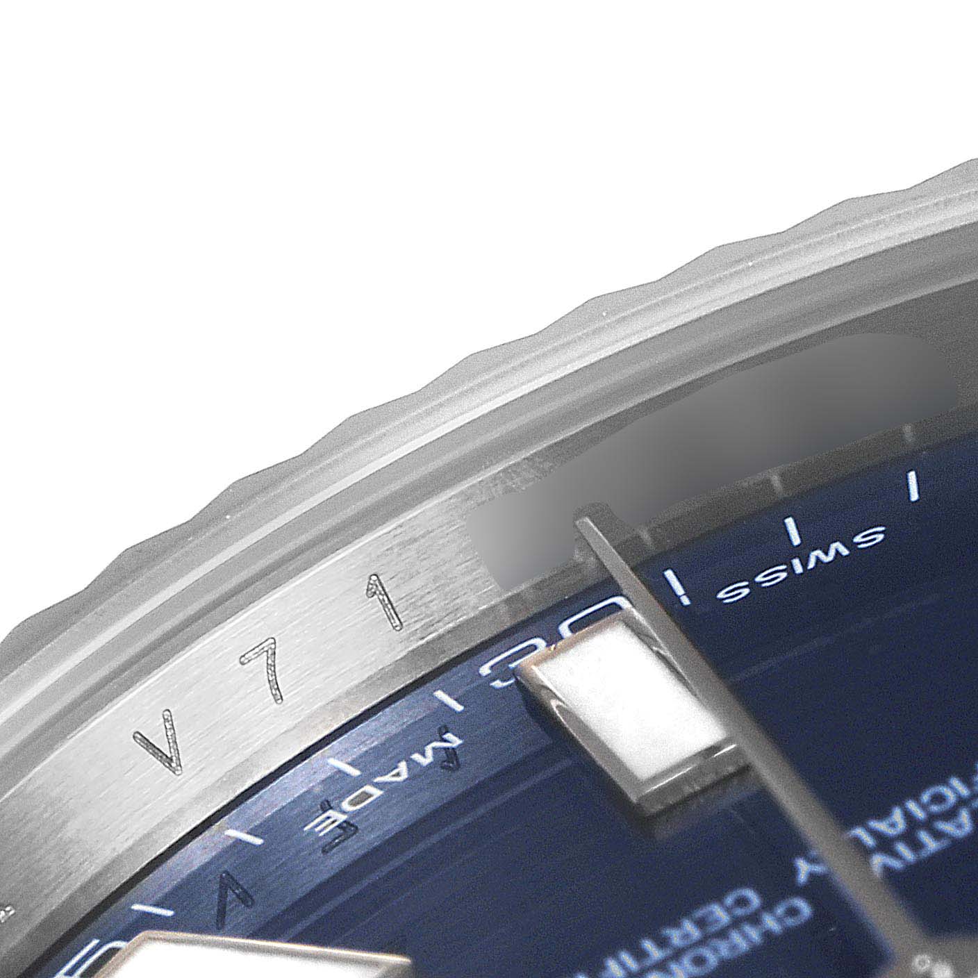 This image shows a close-up of the Datejust 41 model by Rolex, featuring part of the dial, indices, and edge of the bezel.