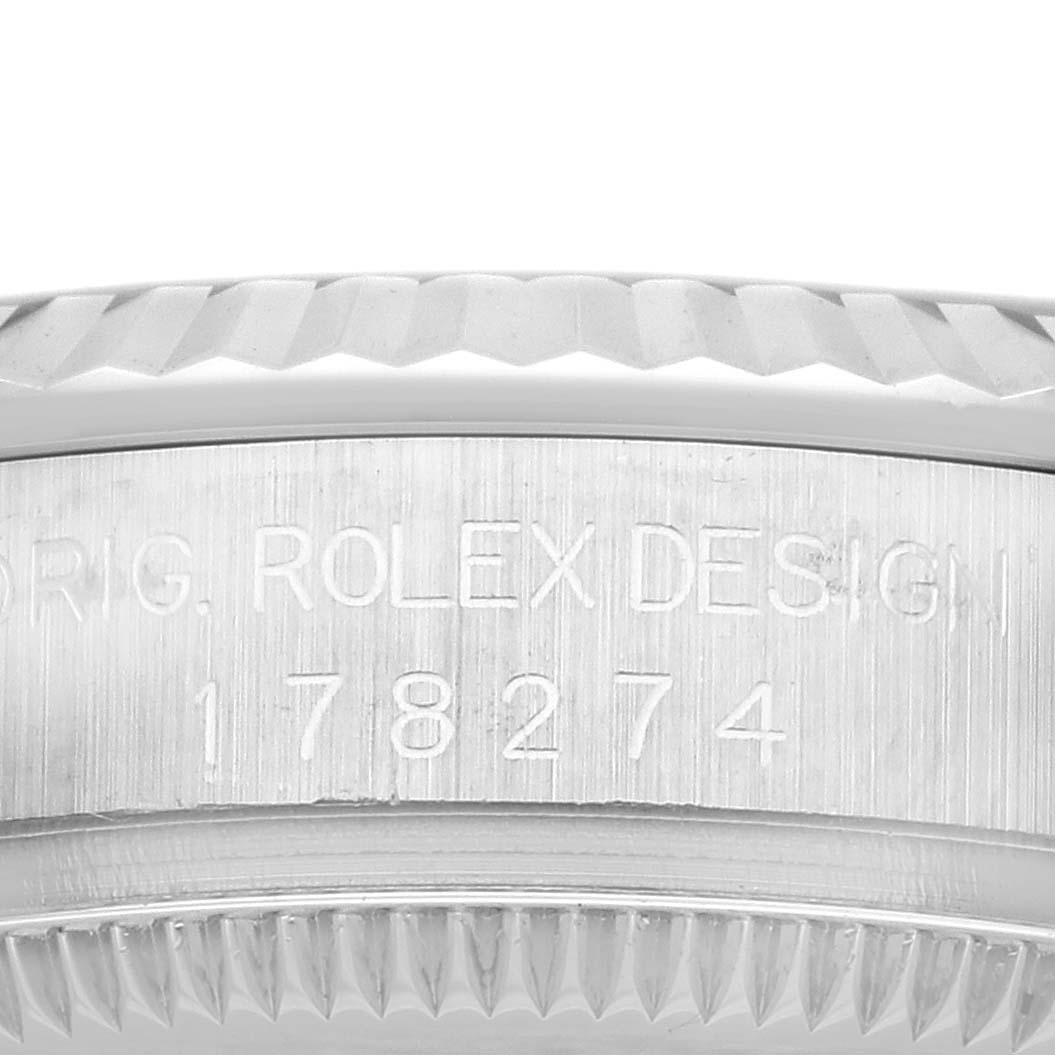 This image shows a close-up of the model number engraving on the side of the bezel and case of a Mid-Size Rolex watch.