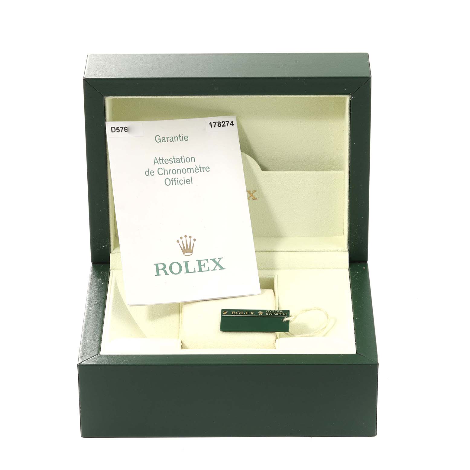 The image shows a green Rolex box for the Mid-Size model, containing documentation and a label.