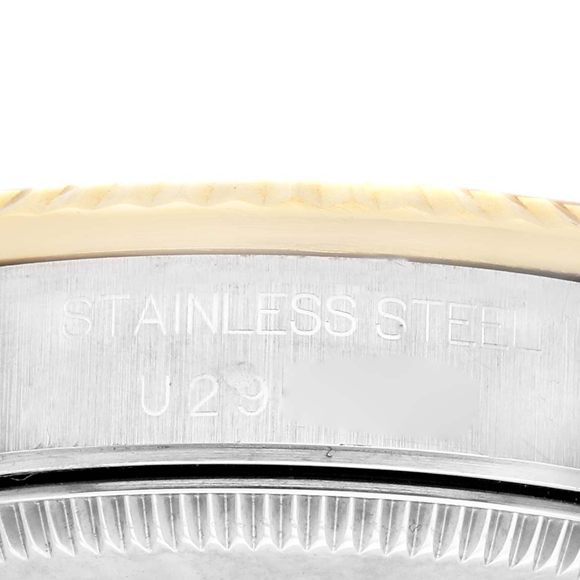The image shows a close-up of the engraved stainless steel case side of a Mid-Size Rolex watch.