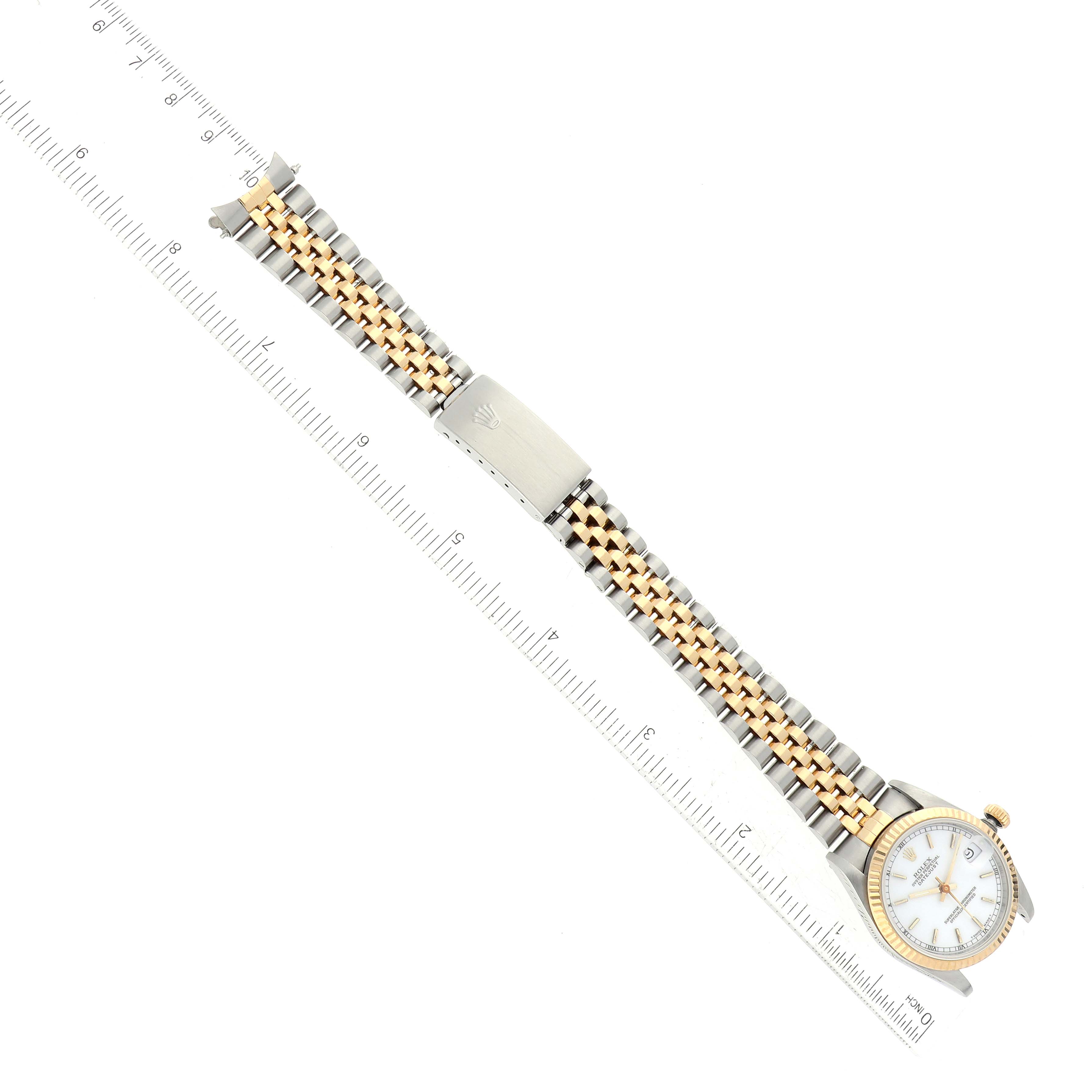 This image shows a top-down view of a Rolex Mid-Size 68273 Women's Steel and Gold (two tone) White Dial 68273 Women's Steel and Gold (two tone) White Dial model watch with its bezel, dial, and metal bracelet visible.