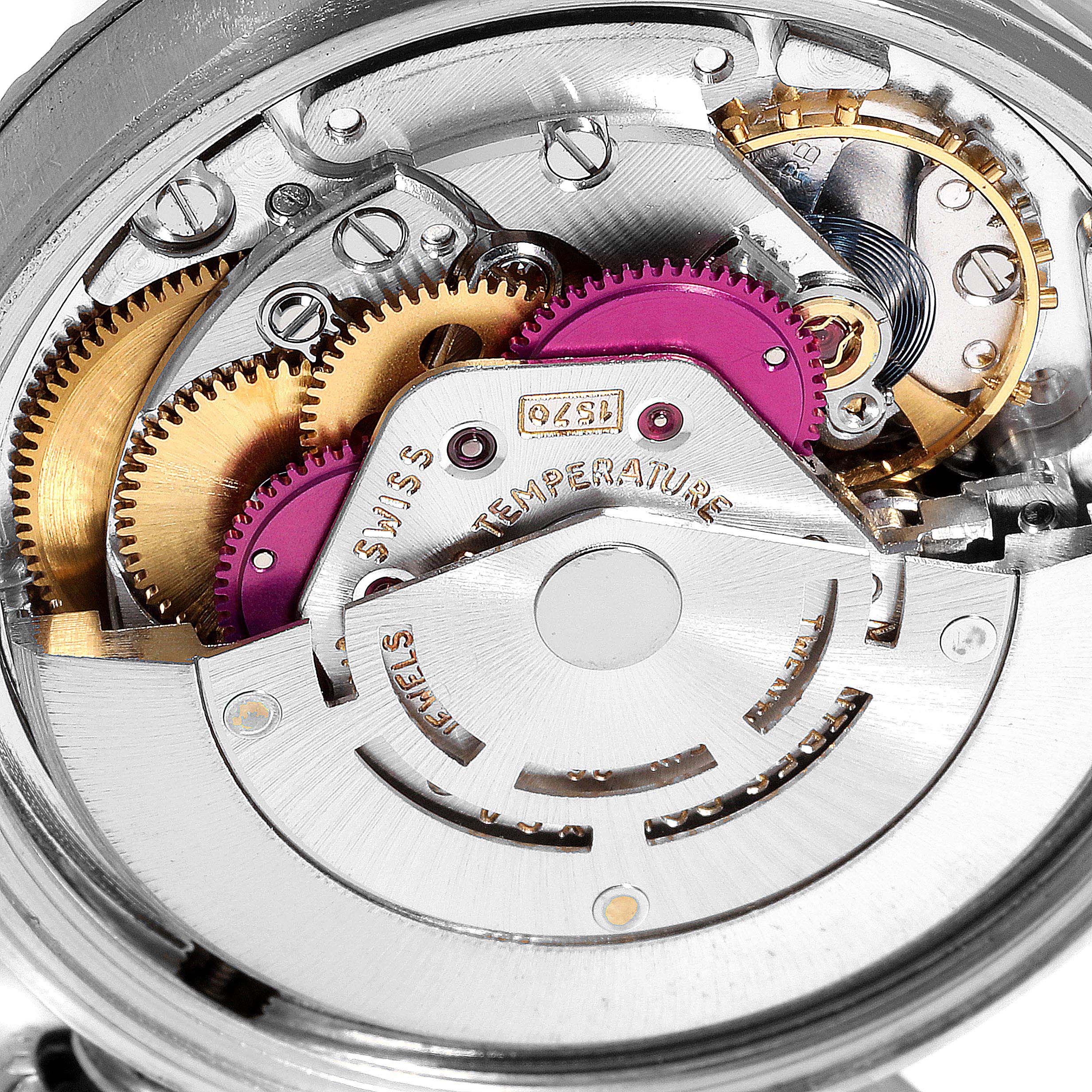 Close-up of the internal mechanisms of a Vintage Collection Rolex watch, showing gears and components.