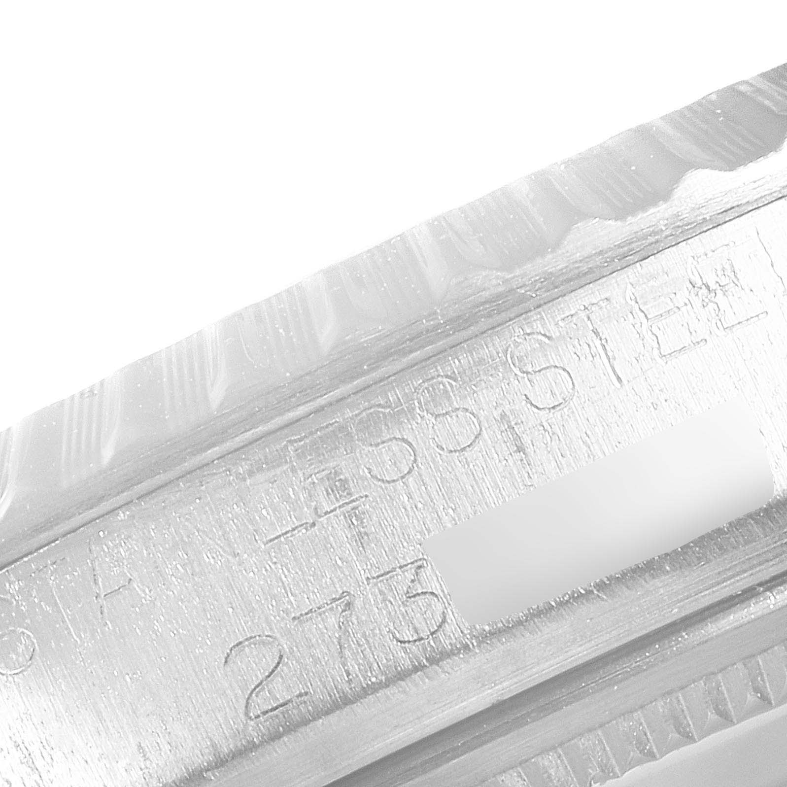 This close-up image shows the engraved side of the case for the Rolex Vintage Collection 1603 Men's Stainless Steel Silver Dial 1603 Men's Stainless Steel Silver Dial model.