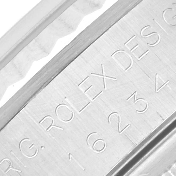 This close-up image shows the engraved serial number and design markings on the side of a Rolex Datejust 16234 Men's Stainless Steel Silver Dial 16234 Men's Stainless Steel Silver Dial watch casing.