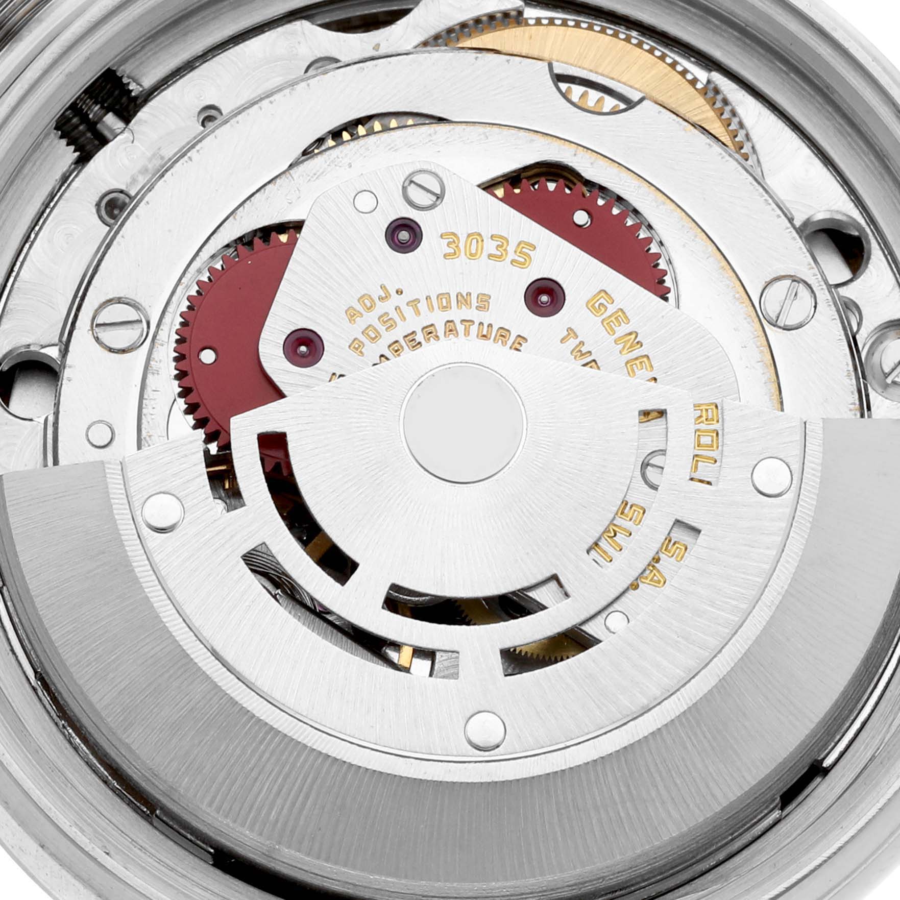The image shows the intricate internal mechanism of the Vintage Collection Rolex watch, showcasing gears and moving parts.