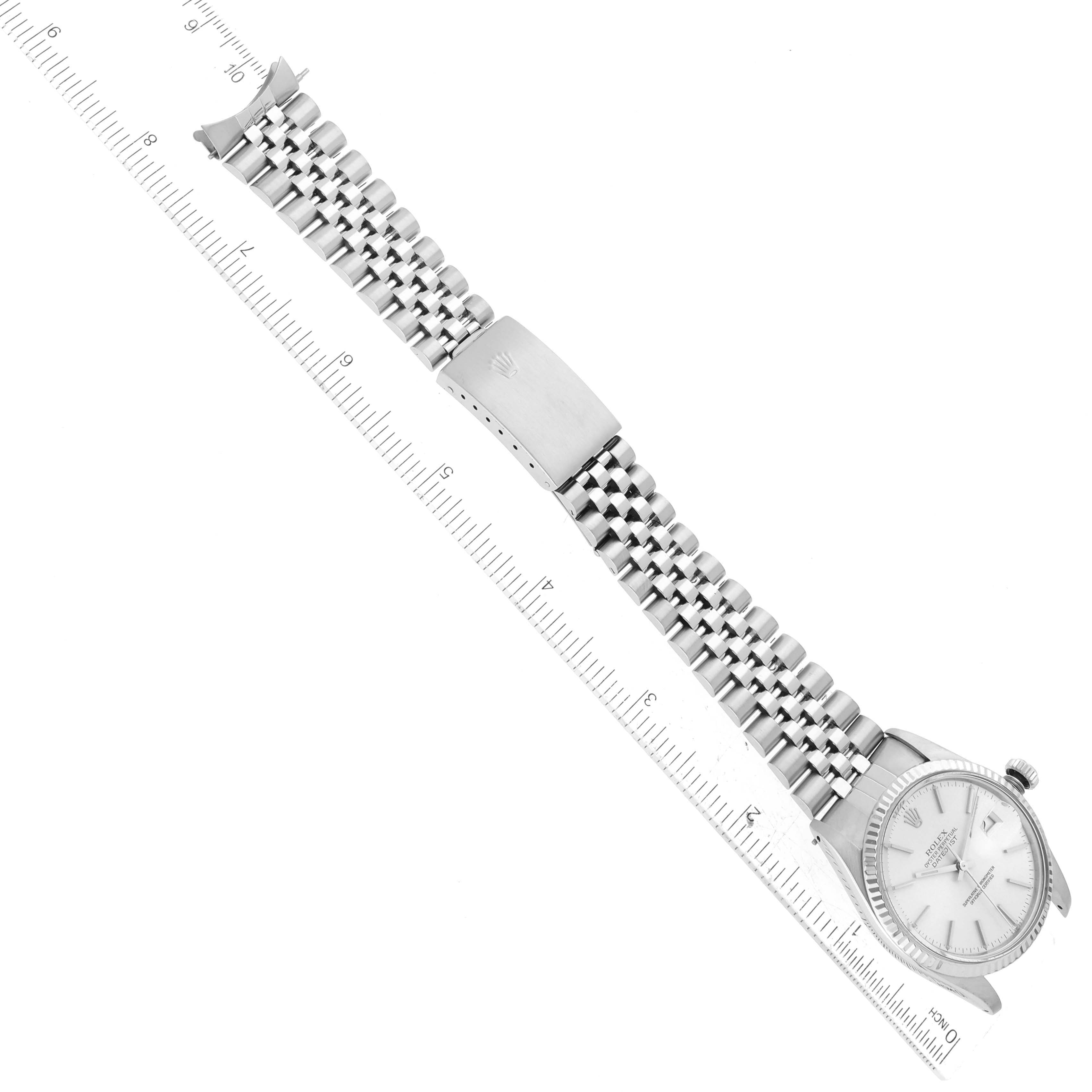 This image shows a Vintage Collection Rolex watch laid flat with its band extended and a ruler for scale.