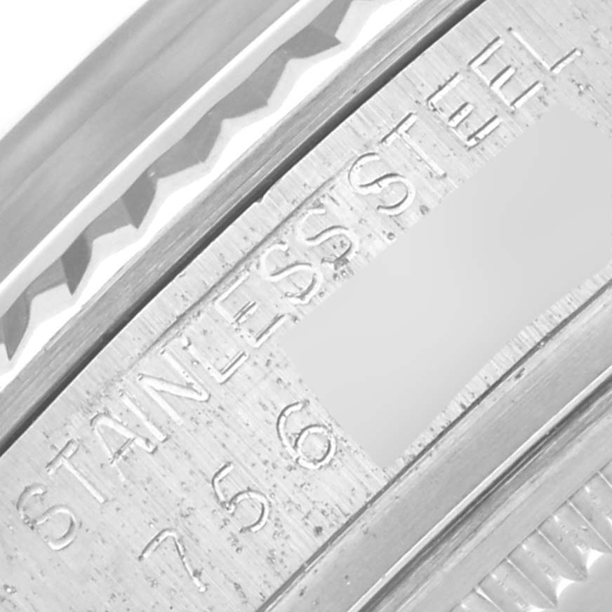 This image shows a close-up of the side casing and engravings on a Rolex Vintage Collection 16014 Men's Stainless Steel Silver Dial 16014 Men's Stainless Steel Silver Dial model made from stainless steel.