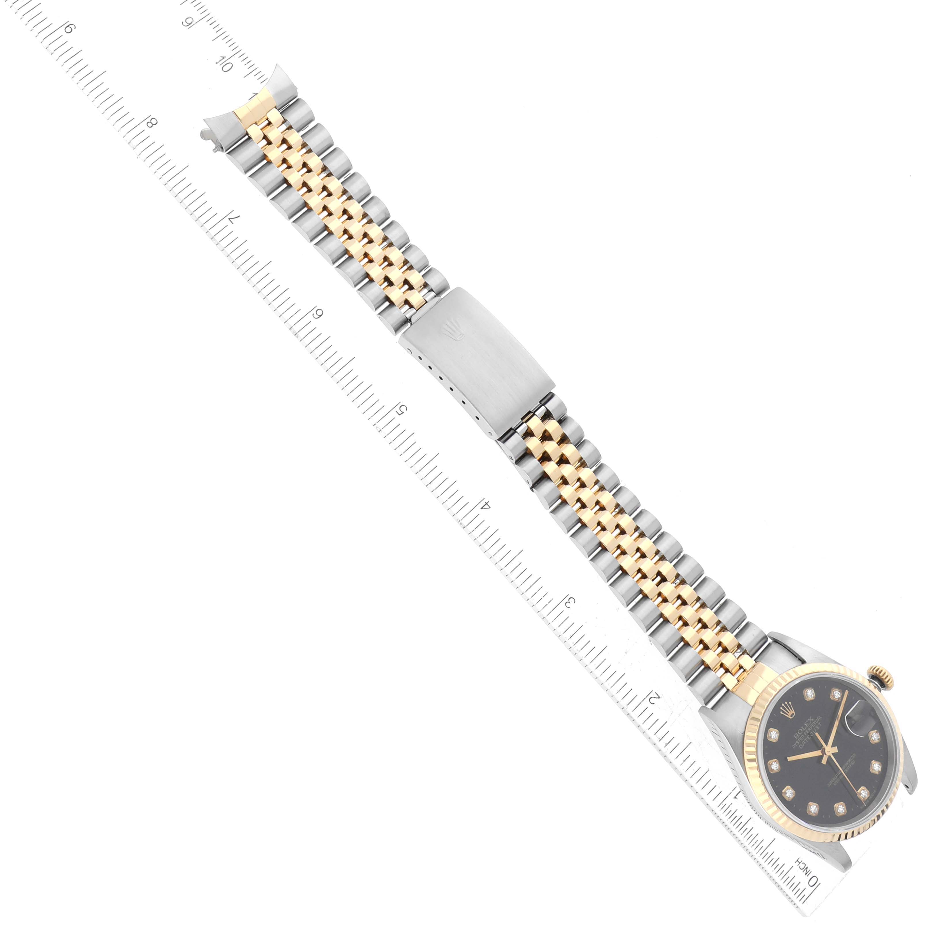 The image shows a top-down view of a Rolex Datejust 16233 Men's Steel and Gold (two tone) Black Dial 16233 Men's Steel and Gold (two tone) Black Dial watch, highlighting the watch face, bezel, bracelet, and clasp.