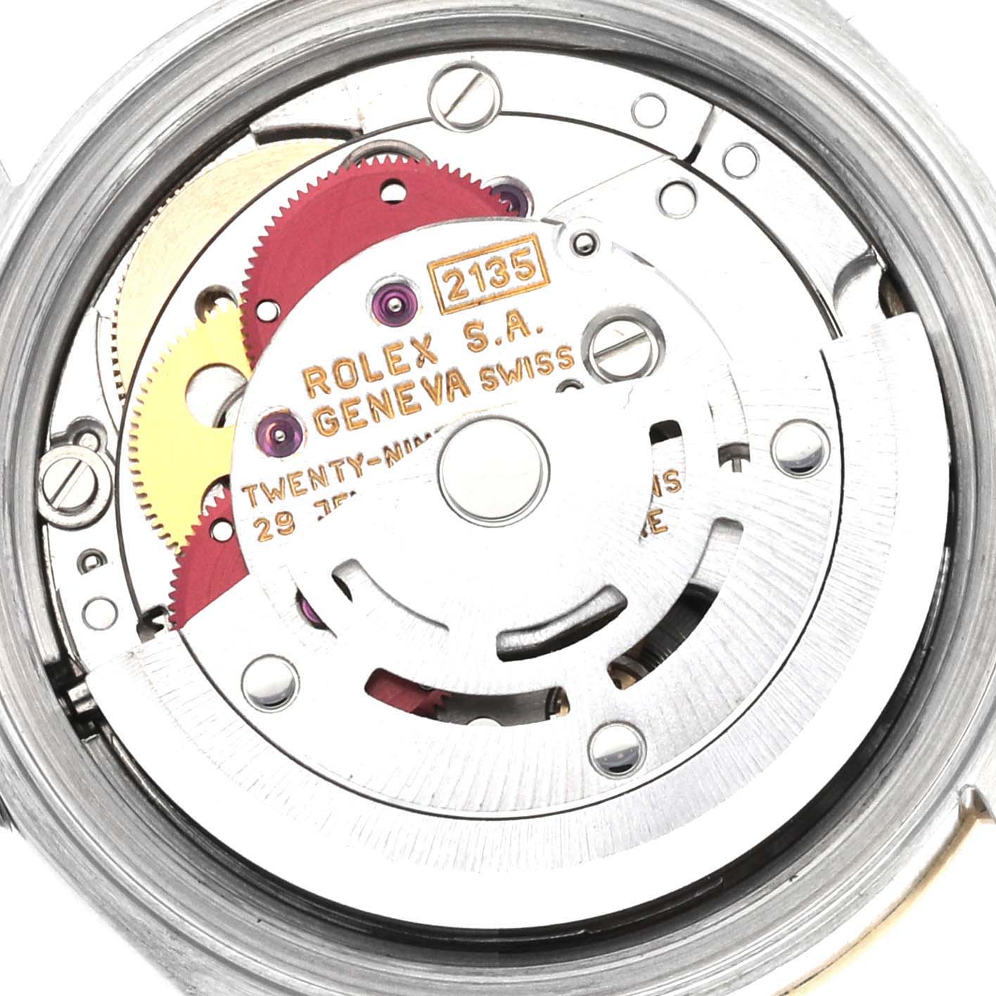 The image shows the internal movement mechanism of the Rolex Datejust 69173 Women's Steel and Gold (two tone) Champagne Dial 69173 Women's Steel and Gold (two tone) Champagne Dial watch, highlighting gears and engravings.
