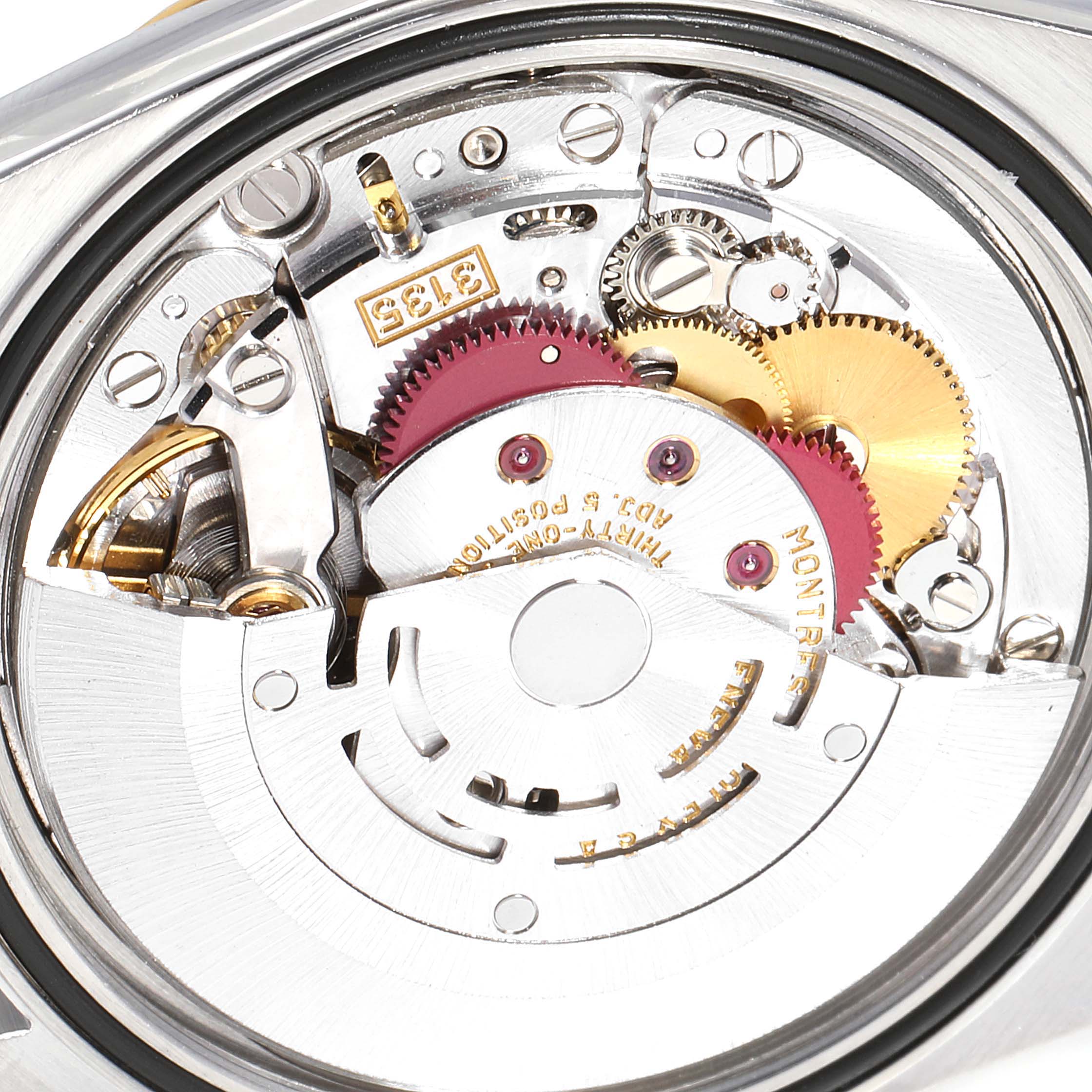 This image shows the intricate interior mechanism of a Rolex Datejust 16233 Men
s Steel and Gold (two tone) Mother of Pearl Dial 16233 Men
s Steel and Gold (two tone) Mother of Pearl Dial watch from a close-up angle.