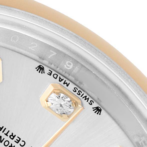 The image shows a close-up of the dial and diamond marker of a Rolex Datejust 279163 Women's Steel and Gold (two tone) Silver Dial, highlighting the "SWISS MADE" text.
