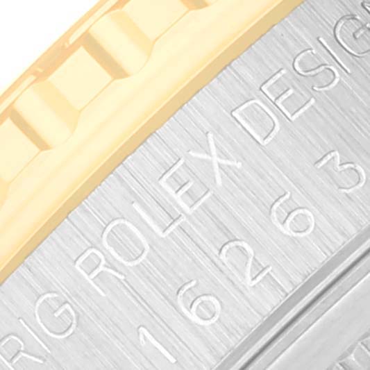 This close-up image shows the bezel and the serial engraving on the side of a Rolex Turn-o-Graph 16263 Men's Steel and Gold (two tone) Champagne Dial 16263 Men's Steel and Gold (two tone) Champagne Dial watch.