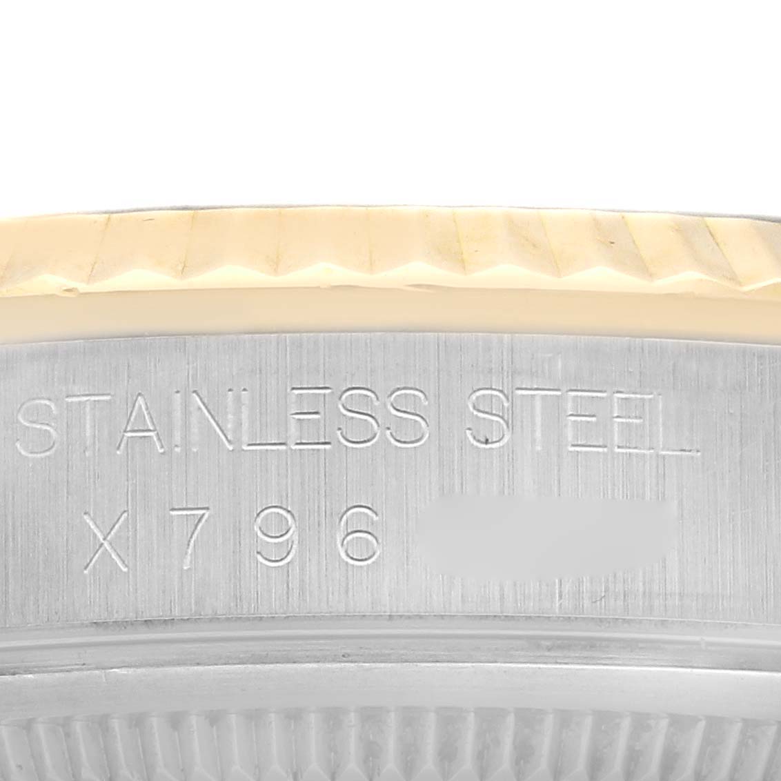 This image shows a close-up of the side of a Rolex Datejust 16233 Men's Steel and Gold (two tone) White Dial 16233 Men's Steel and Gold (two tone) White Dial watch, highlighting the "STAINLESS STEEL" engraving and part of the model number.