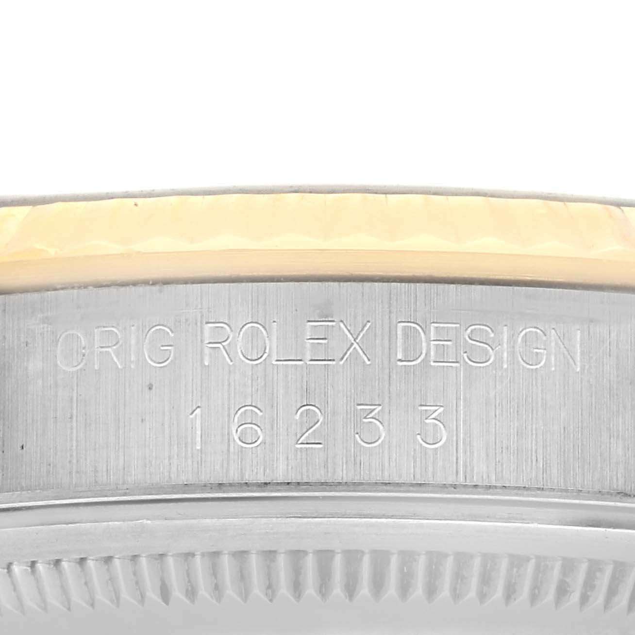 The image shows the engraved case side of a Rolex Datejust 16233 Men's Steel and Gold (two tone) White Dial 16233 Men's Steel and Gold (two tone) White Dial watch, focusing on its model number and "ORIG ROLEX DESIGN" text.