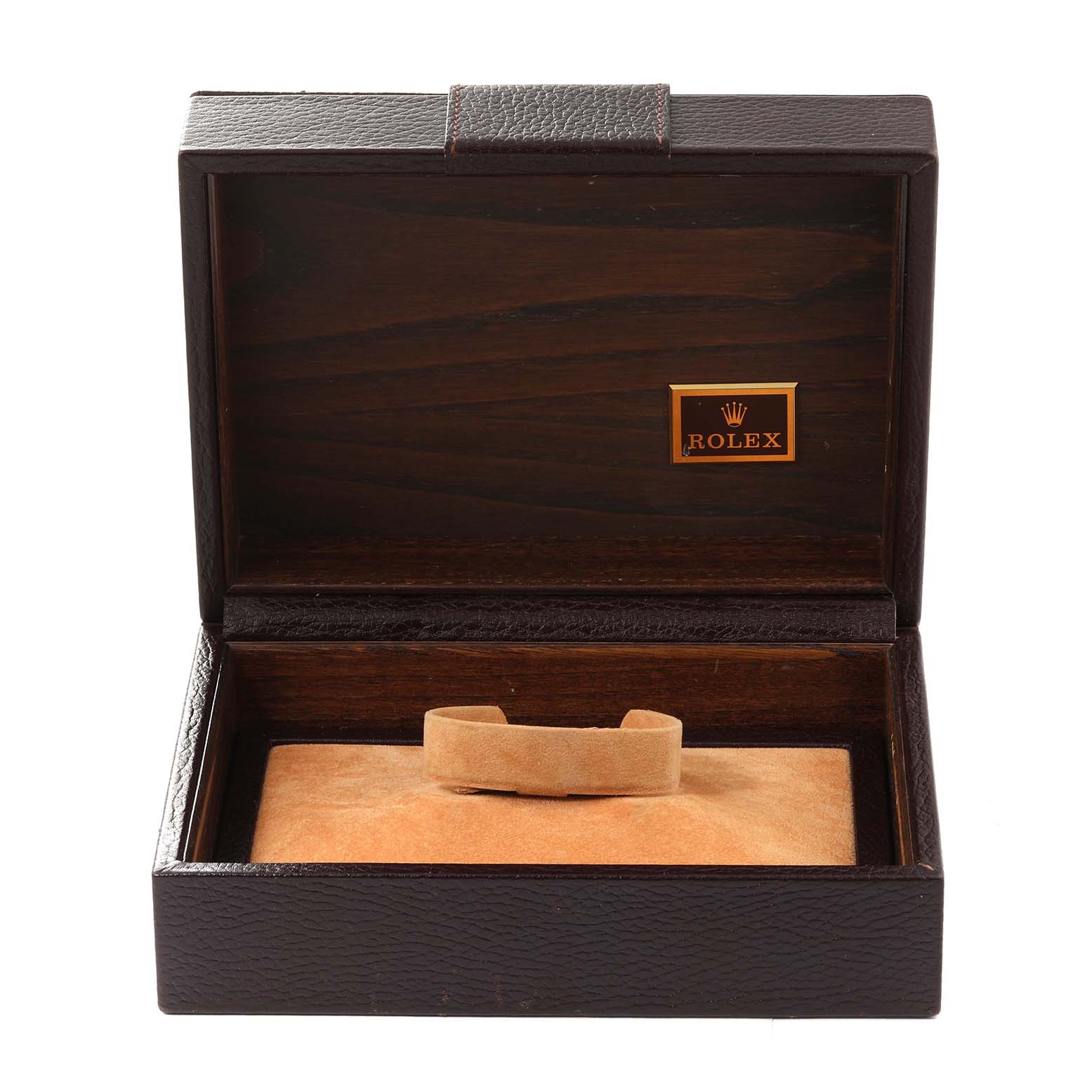 The image shows an open Rolex watch box for the President model, displaying the interior with a cushion for holding the watch.