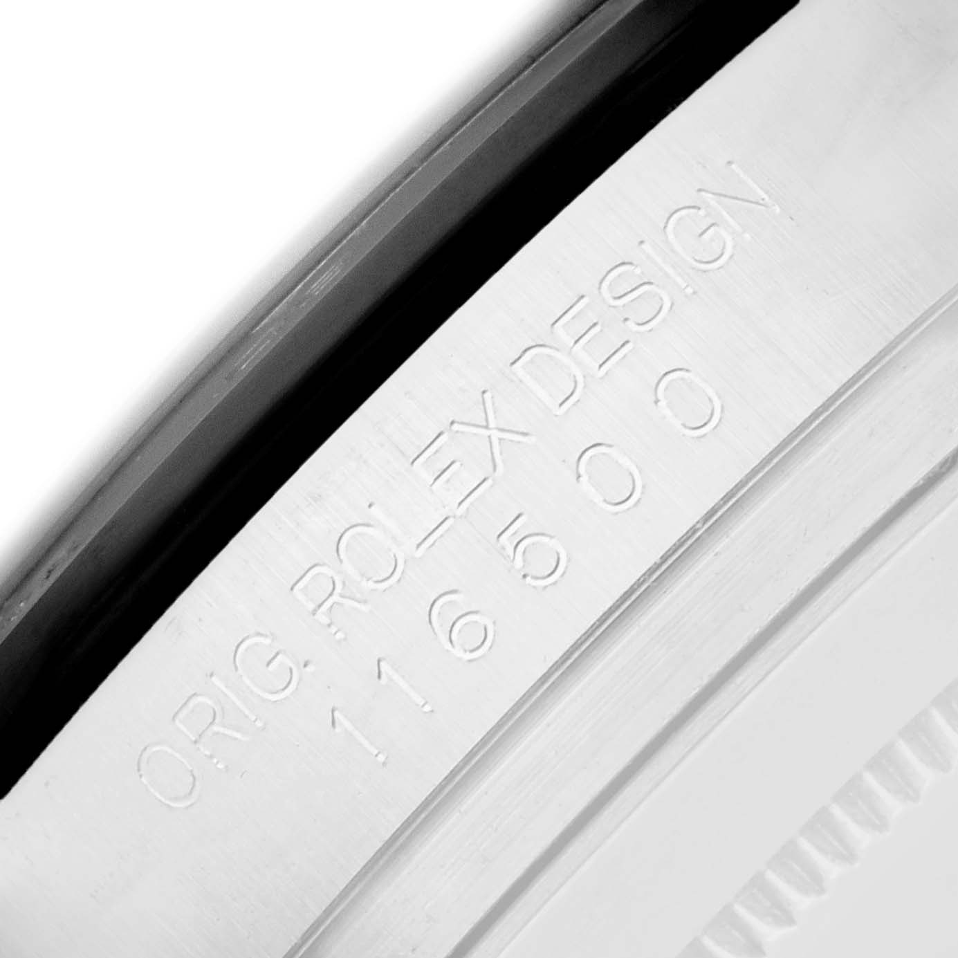 The image shows a close-up of the engraved inner bezel of the Rolex Daytona 116500 Men
s Stainless Steel White Dial model, highlighting its design details.