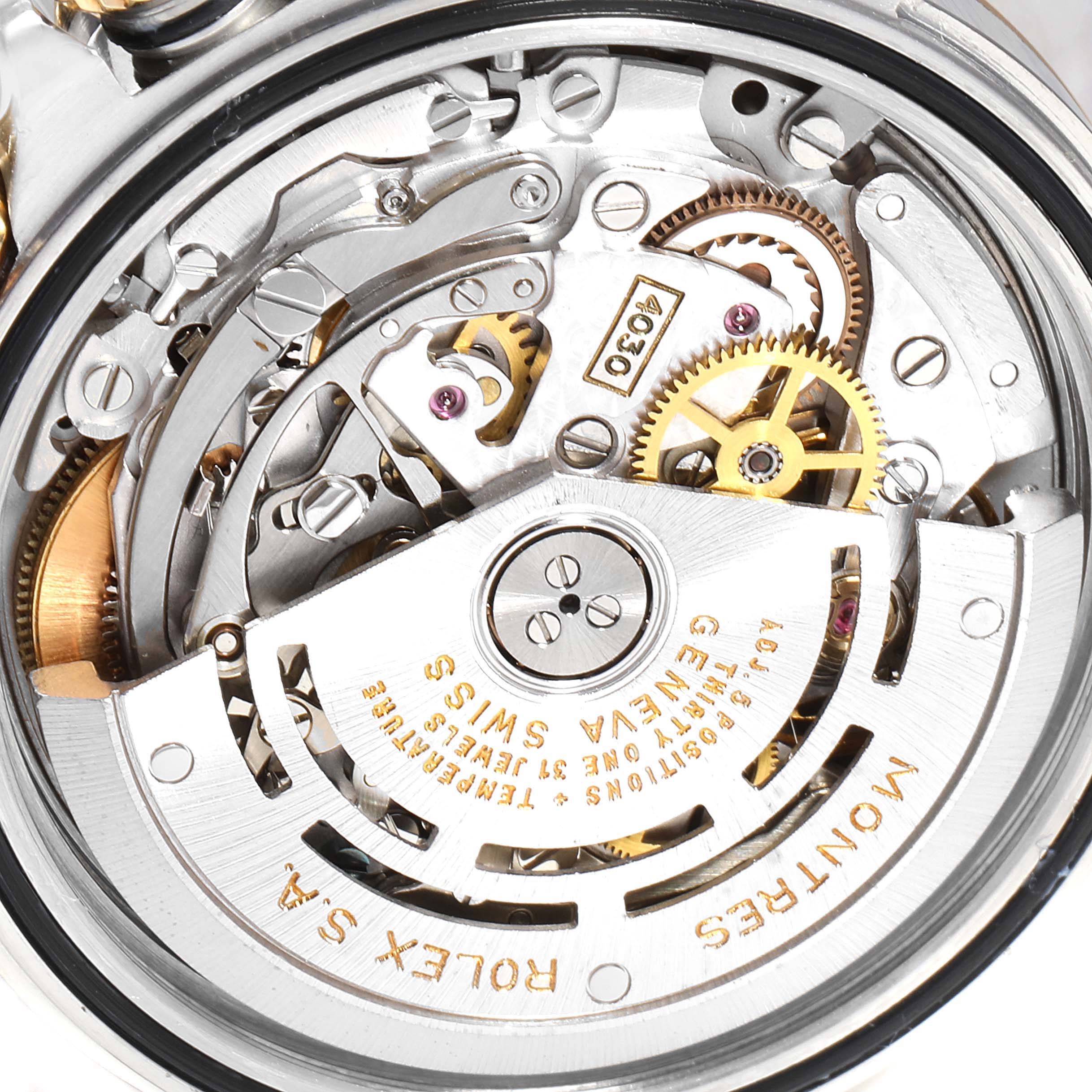 The image shows a close-up view of the movement and internal mechanisms of a Rolex Daytona 16523 Men's Steel and Gold (two tone) Champagne Dial 16523 Men's Steel and Gold (two tone) Champagne Dial watch.