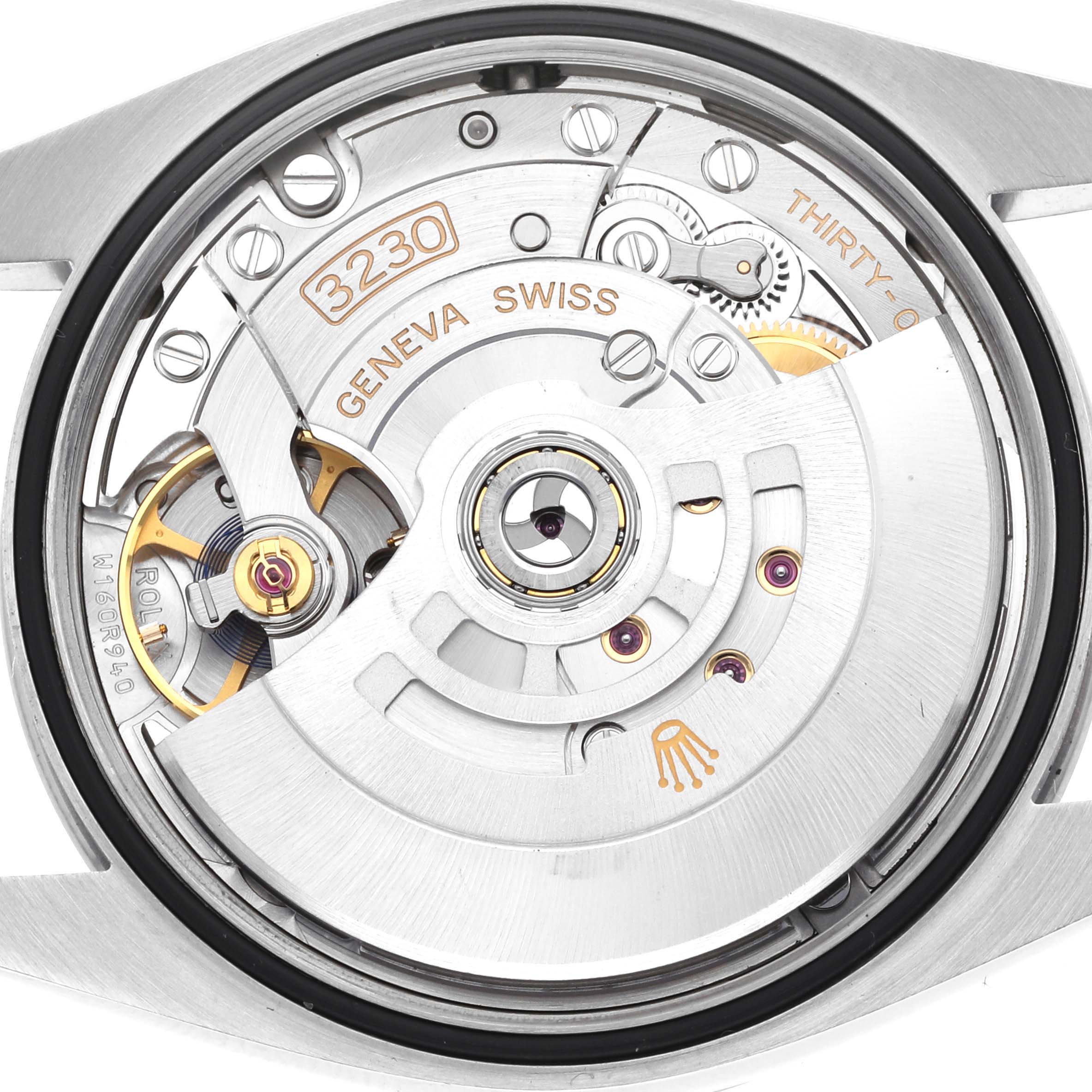 The image shows the back view of a Rolex Explorer 124270 Men
s Stainless Steel Black Dial watch, highlighting its movement with visible gears and inscriptions.