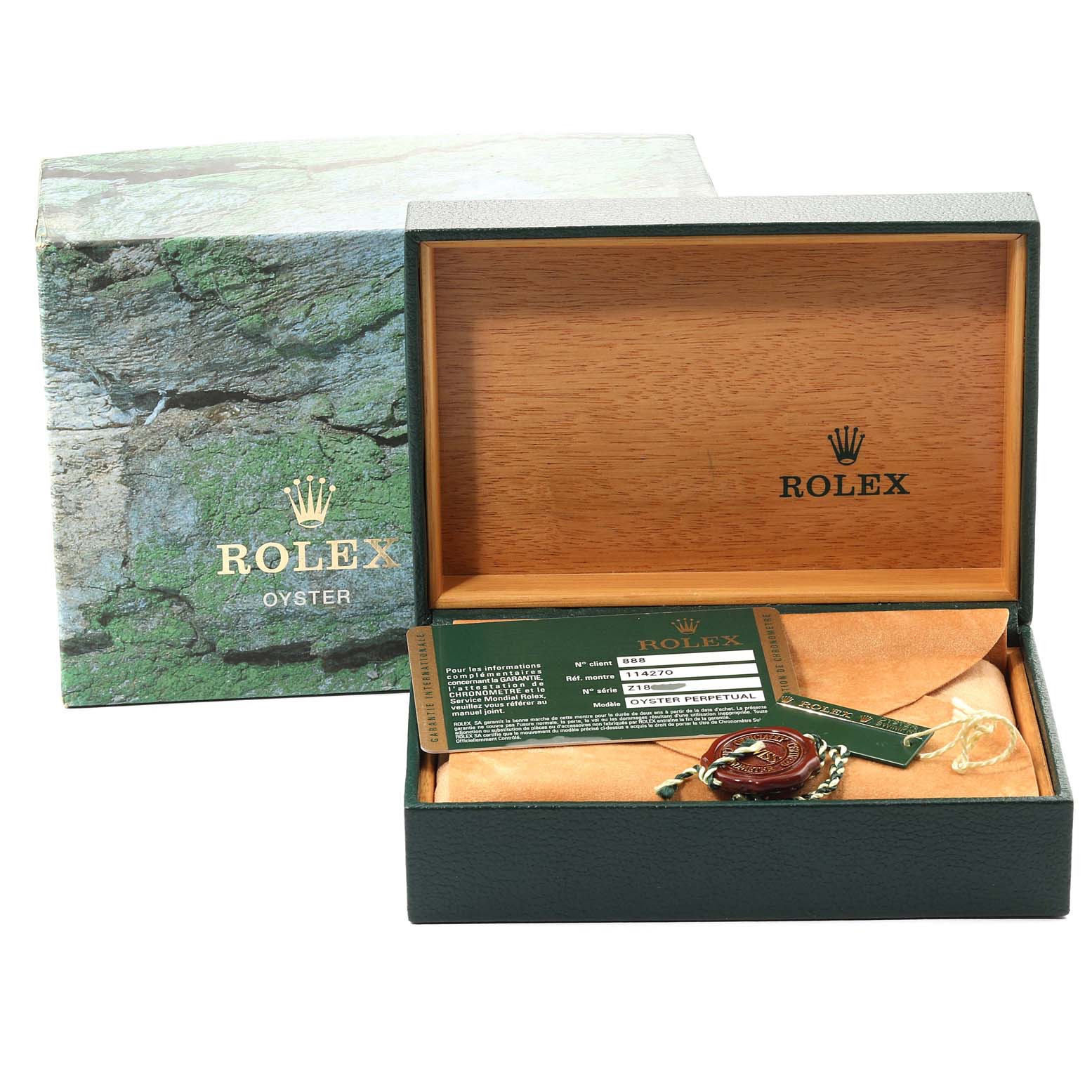 The image shows the packaging and accessories for a Rolex Explorer 114270 Men
s Stainless Steel Black Dial 114270 Men
s Stainless Steel Black Dial model, including the box, tag, and warranty card.
