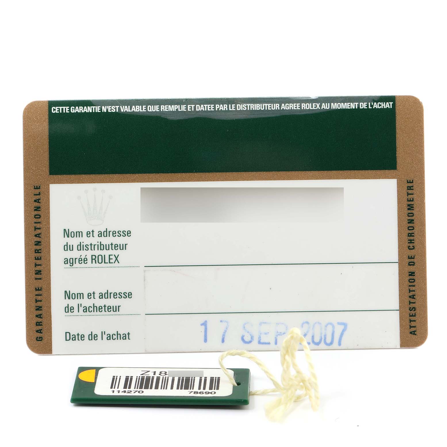 This image shows the warranty card and tag for the Rolex Explorer 114270 Men
s Stainless Steel Black Dial 114270 Men
s Stainless Steel Black Dial watch model.