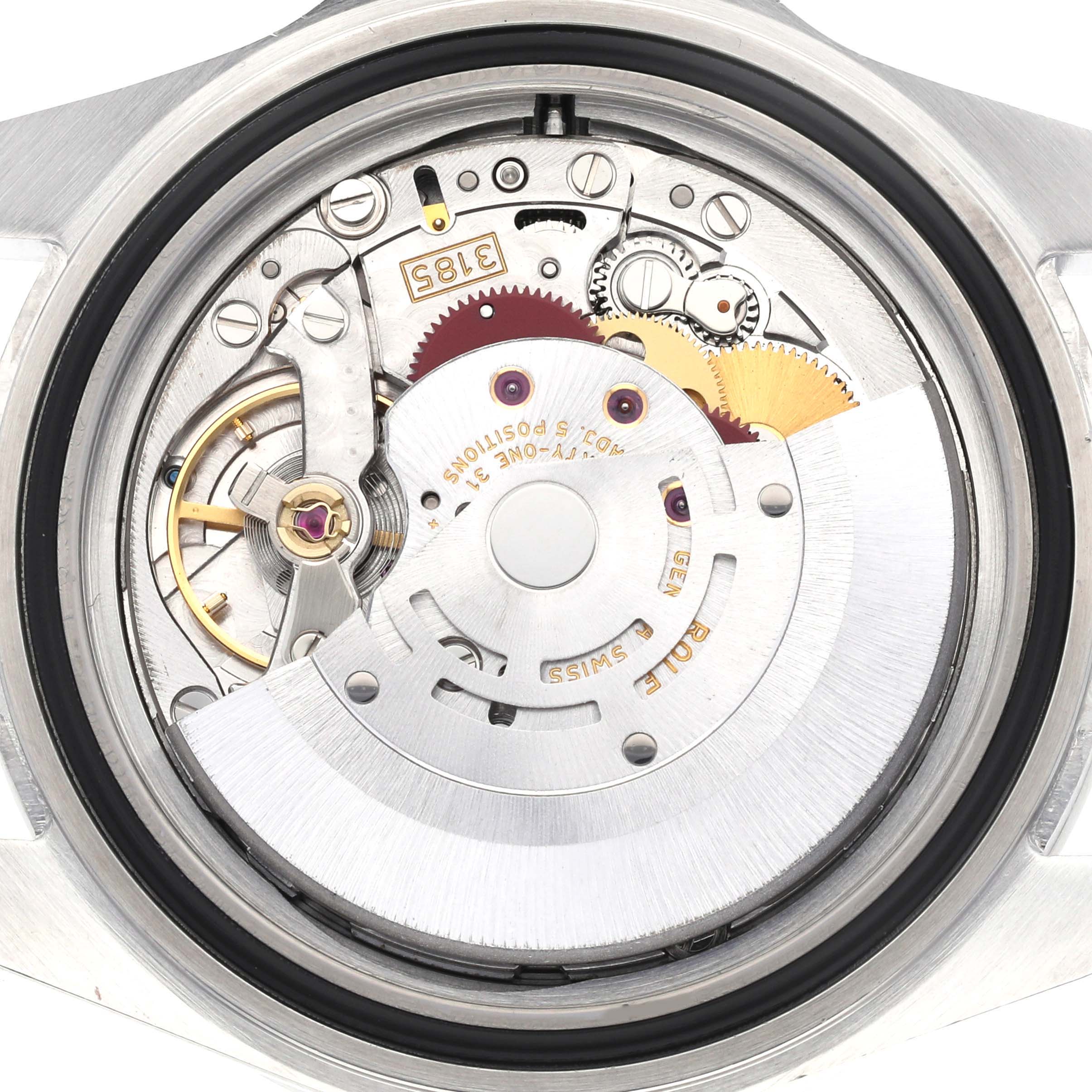 The image shows the internal mechanism of a Rolex Explorer 16570 Men
s Stainless Steel Black Dial 16570 Men
s Stainless Steel Black Dial watch, focusing on the movement parts and gears.