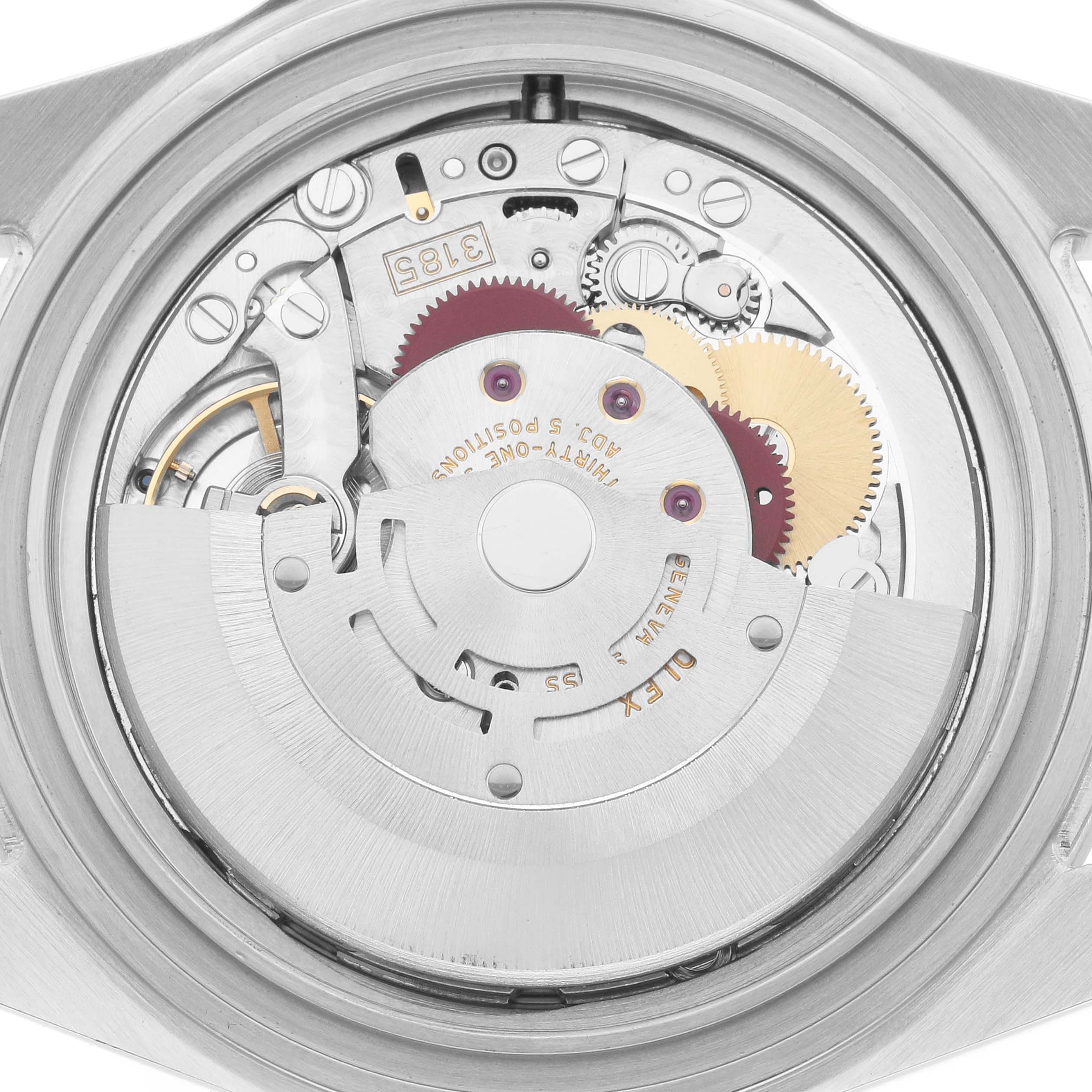 The image shows a close-up of the movement inside a Rolex Explorer 16570 Men
s Stainless Steel White Dial, detailing gears and the rotor.