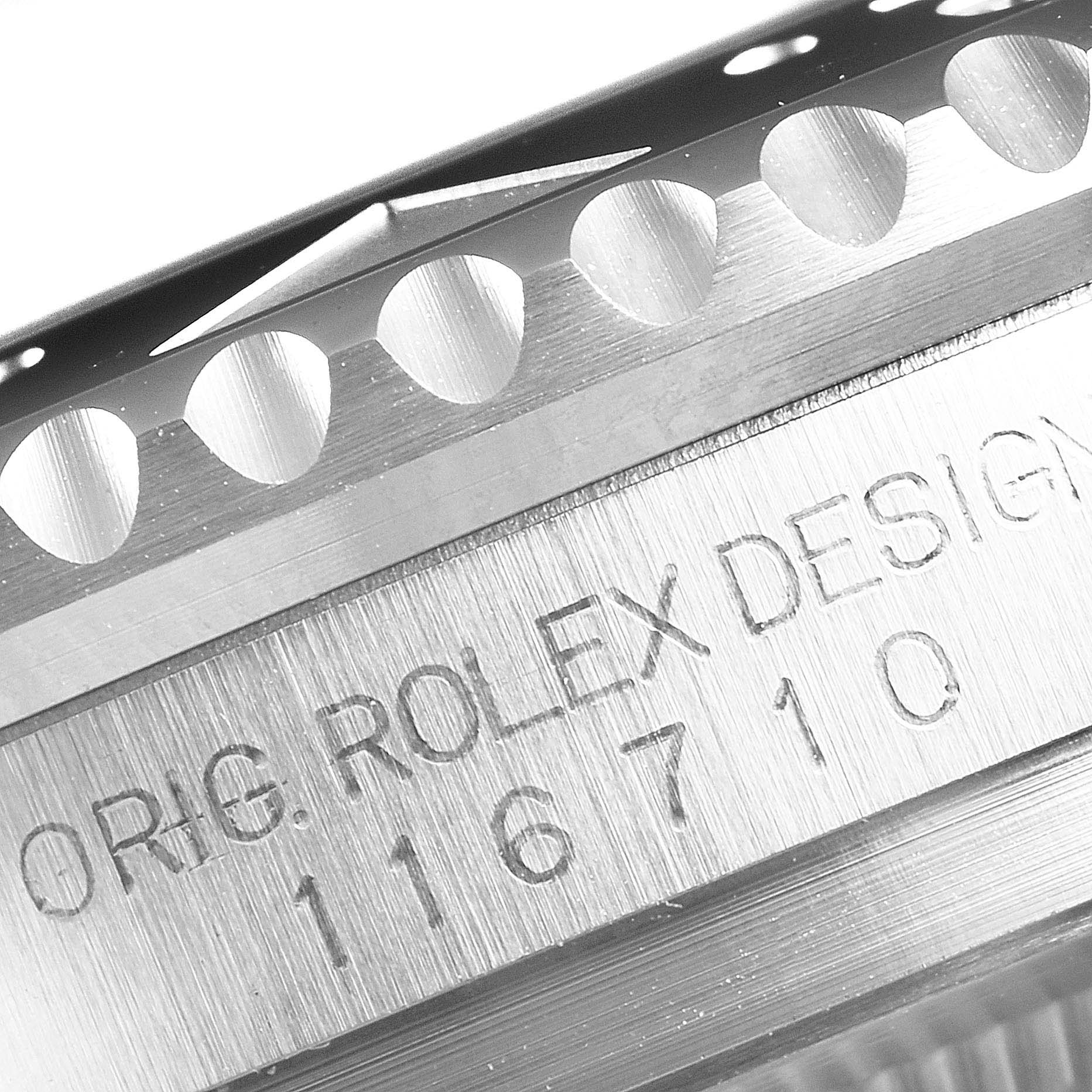 This close-up image shows the side view of the case and bezel of the Rolex GMT-Master 116710 Men
s Stainless Steel Black Dial 116710 Men
s Stainless Steel Black Dial, including engraved model number 116710.