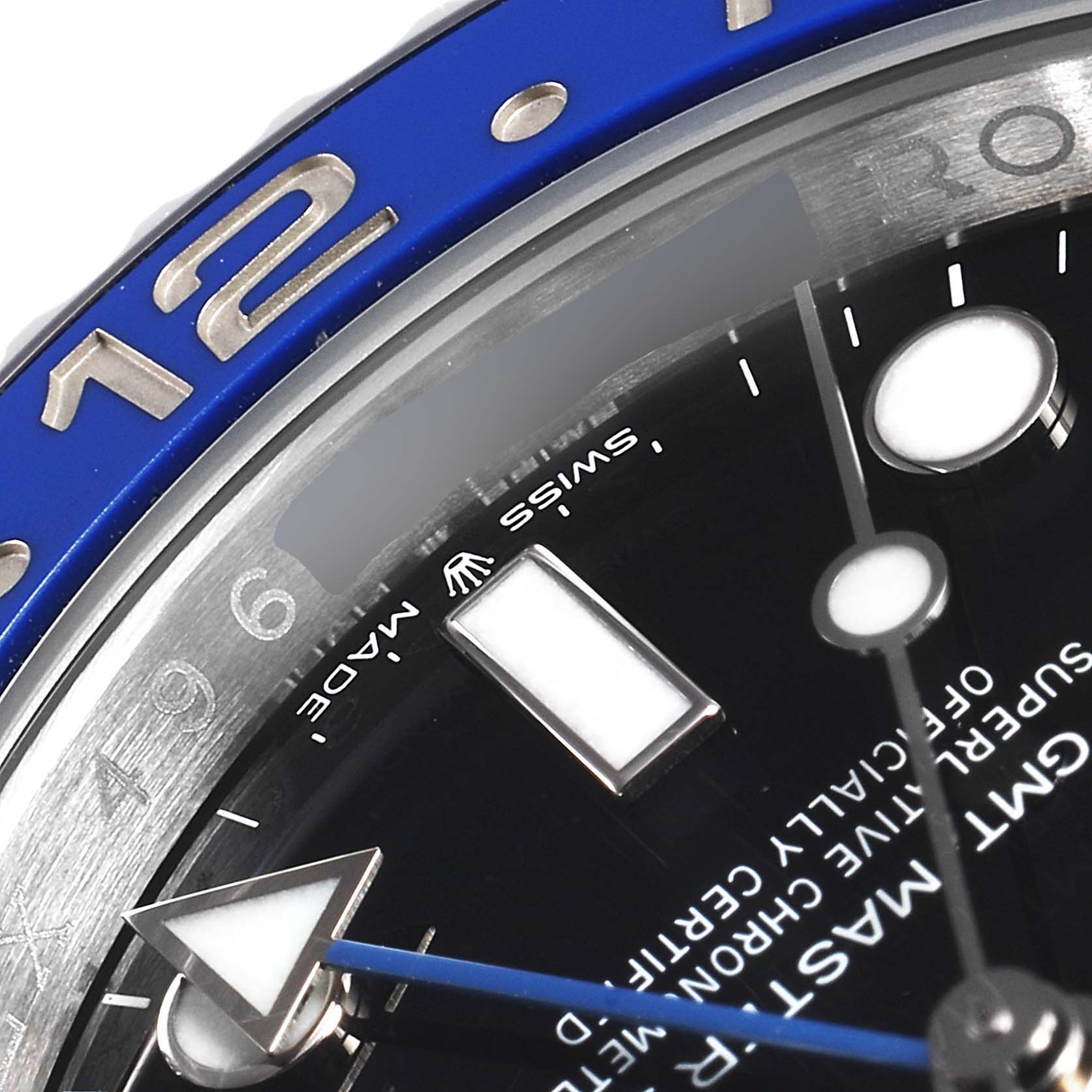 The image shows a close-up of the bezel, dial, and markers of a Rolex GMT-Master 126710 Men
s Stainless Steel Black Dial 126710 Men
s Stainless Steel Black Dial watch, focusing on the blue and silver details.