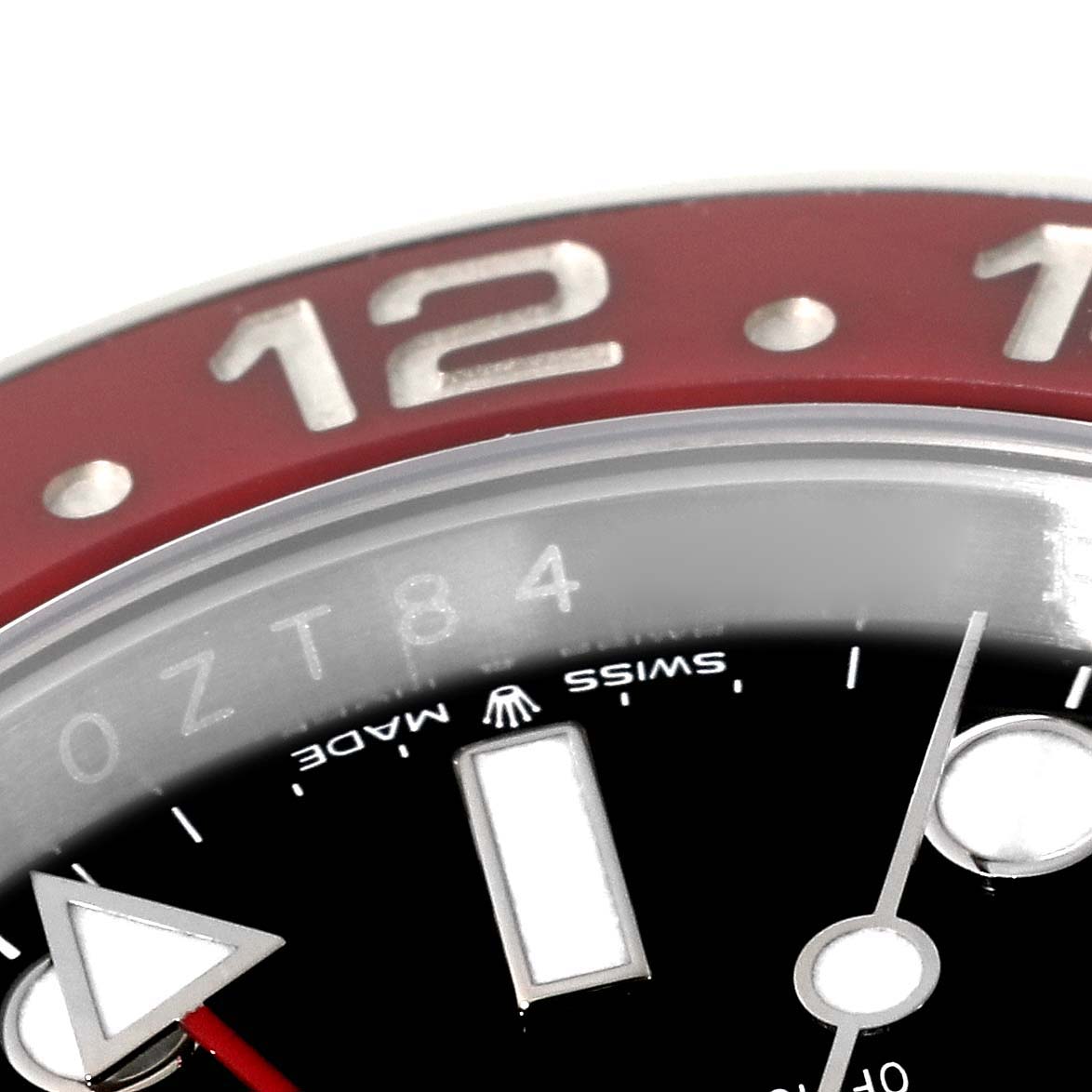 The image shows a close-up of the bezel, part of the dial, and the GMT hand of a Rolex GMT-Master 126710BLRO Men's Stainless Steel Black Dial 126710BLRO Men's Stainless Steel Black Dial watch.