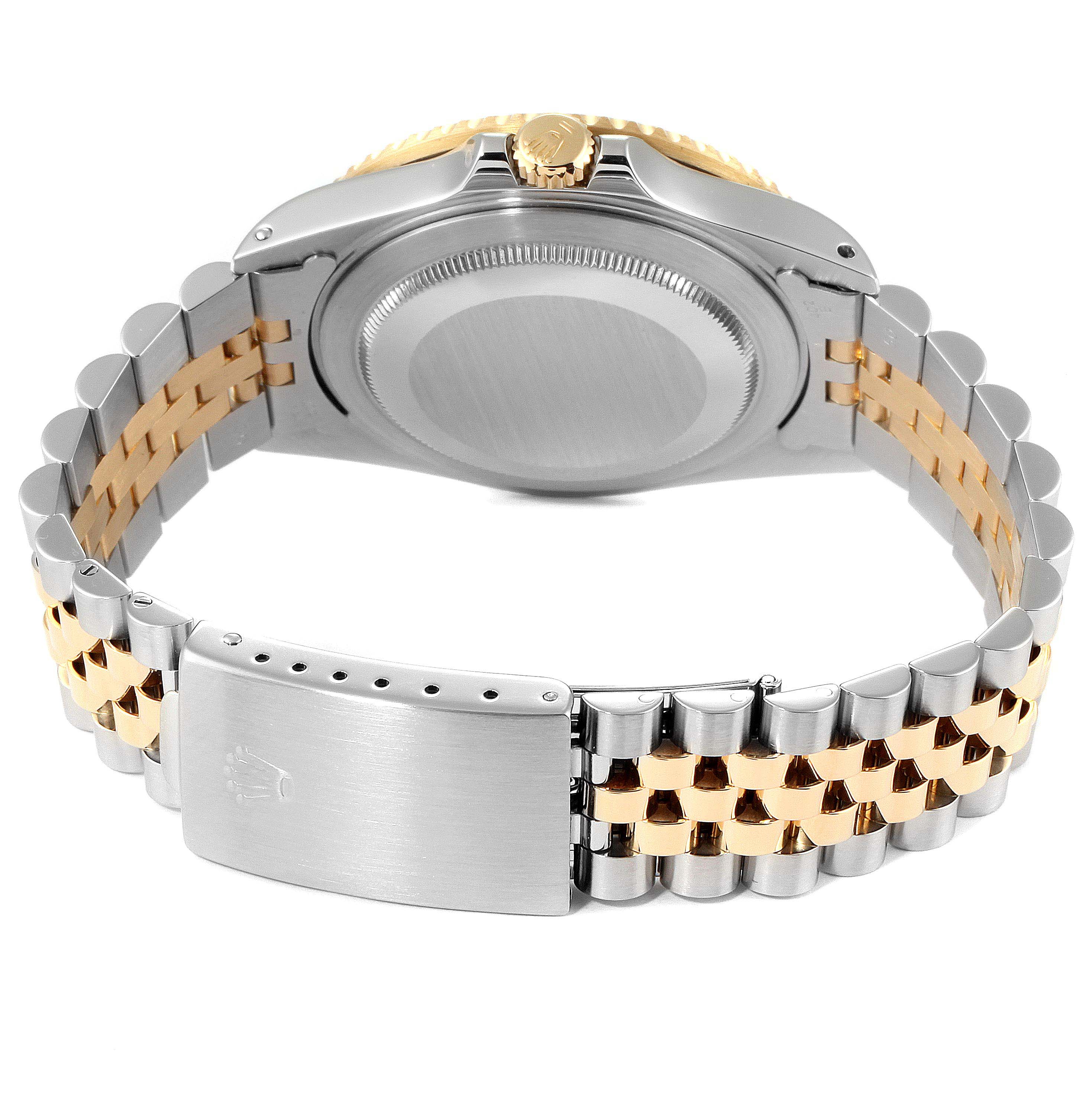 The image shows the back view of a Rolex GMT-Master 16713 Men's Steel and Gold (two tone) Black Dial 16713 Men's Steel and Gold (two tone) Black Dial watch, highlighting the case back, crown, and two-tone metal bracelet with clasp.