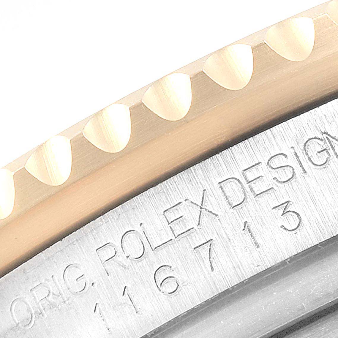 The image shows a close-up of the bezel and side case with the inscription of a Rolex GMT-Master 116713 Men's Steel and Gold (two tone) Black Dial 116713 Men's Steel and Gold (two tone) Black Dial watch.