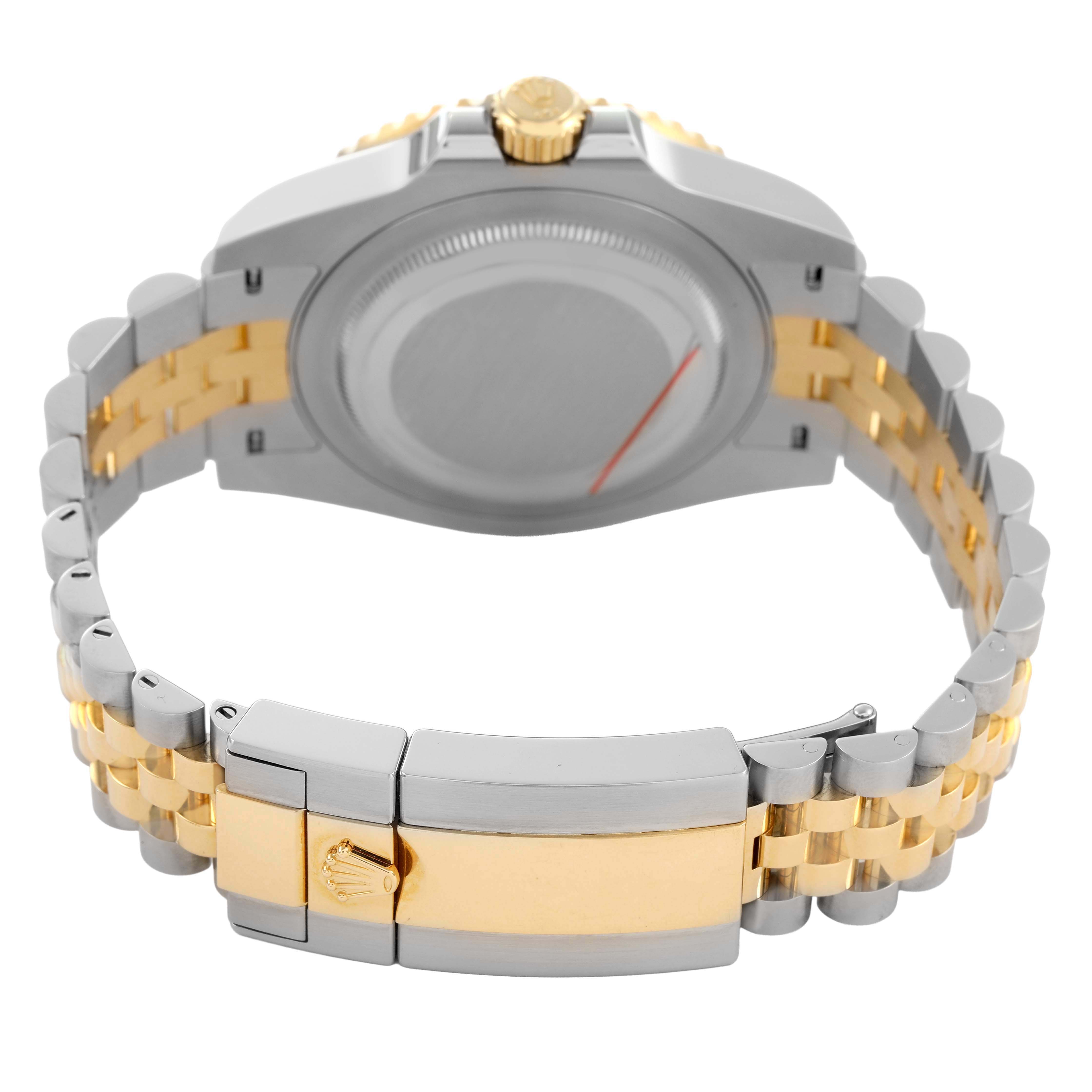 The Rolex GMT-Master 126713GRNR Men's Steel and Gold (two tone) Black Dial watch is shown from the back, highlighting the bracelet, clasp, and case back.